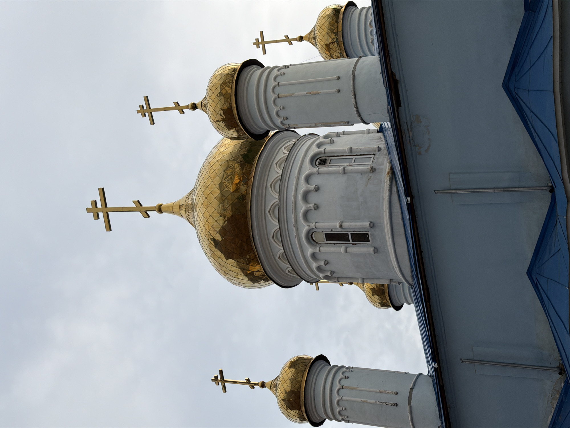 Tourist documents Kazan Kremlin landmarks during afternoon visit