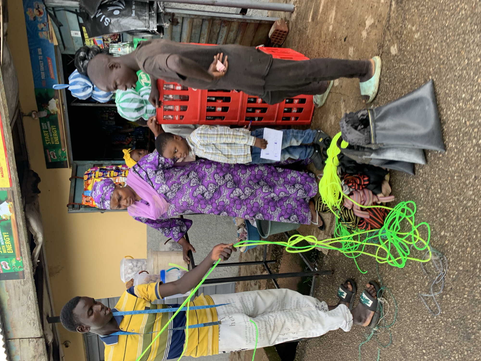 Midday street life near a Jos, Nigeria market area