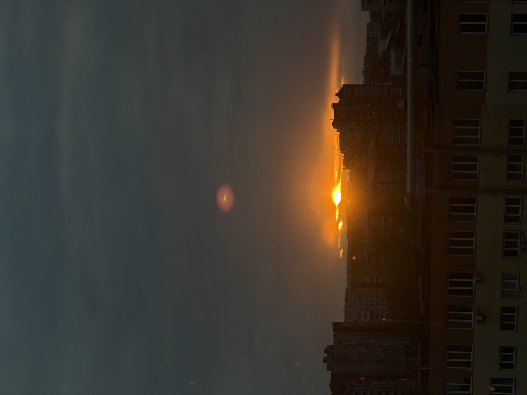 Sunset observed over Krasnoyarsk cityscape from multiple vantage points