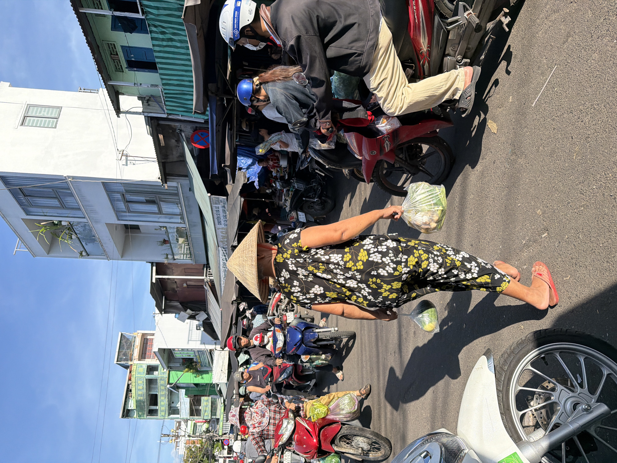 Morning market hustle in Nha Trang, vendors and scooters everywhere