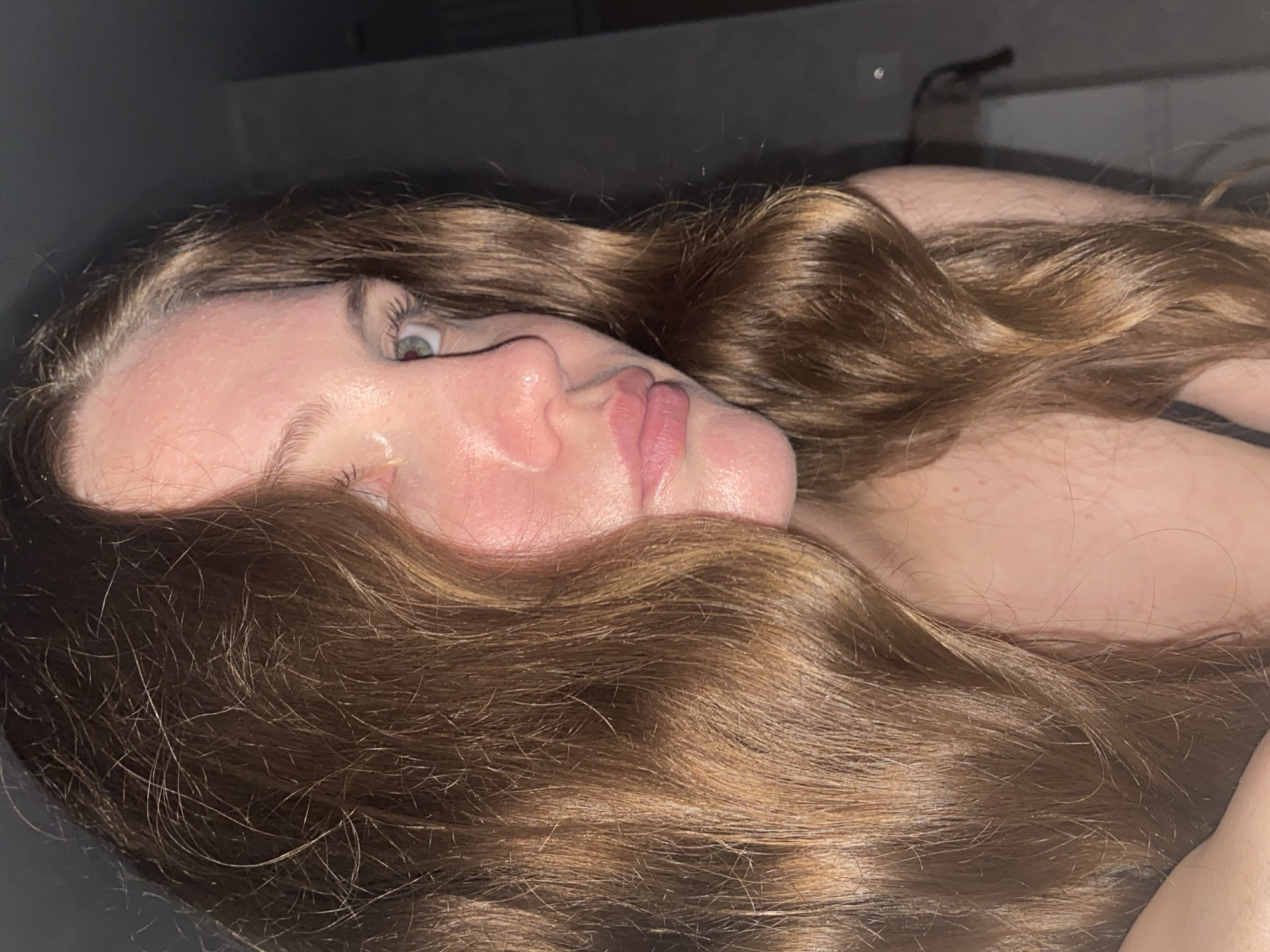 Woman takes selfies in bedroom in Izhevsk, Russia