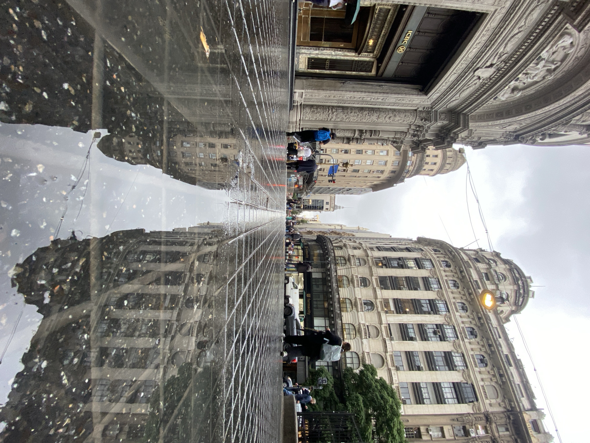 Buenos Aires architectural tour captured in wet-street reflections