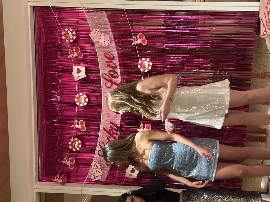 Women pose at casino-themed "Lucky in Love" display in Las Vegas