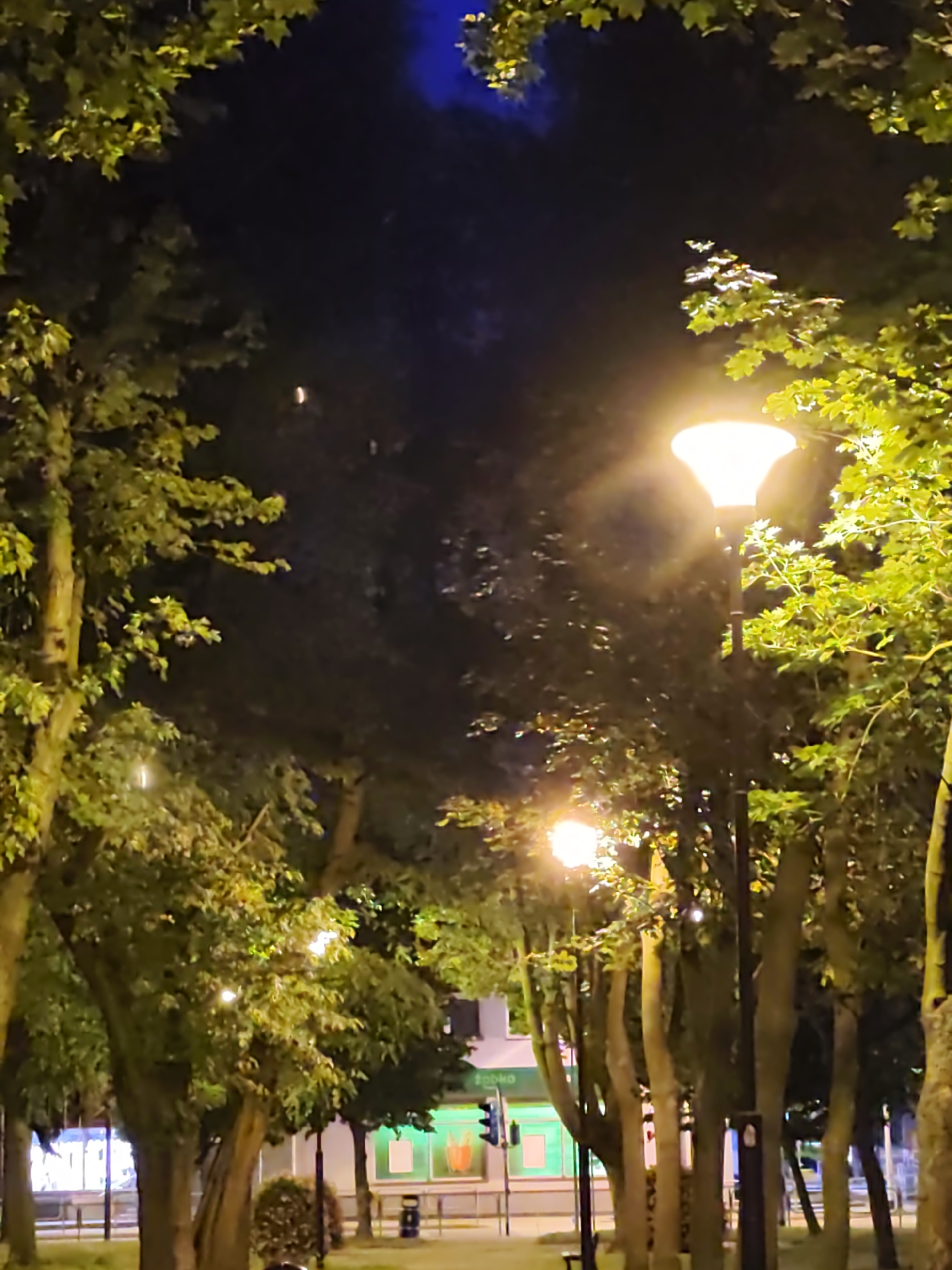 Stryków streets and parks settle into a summer evening