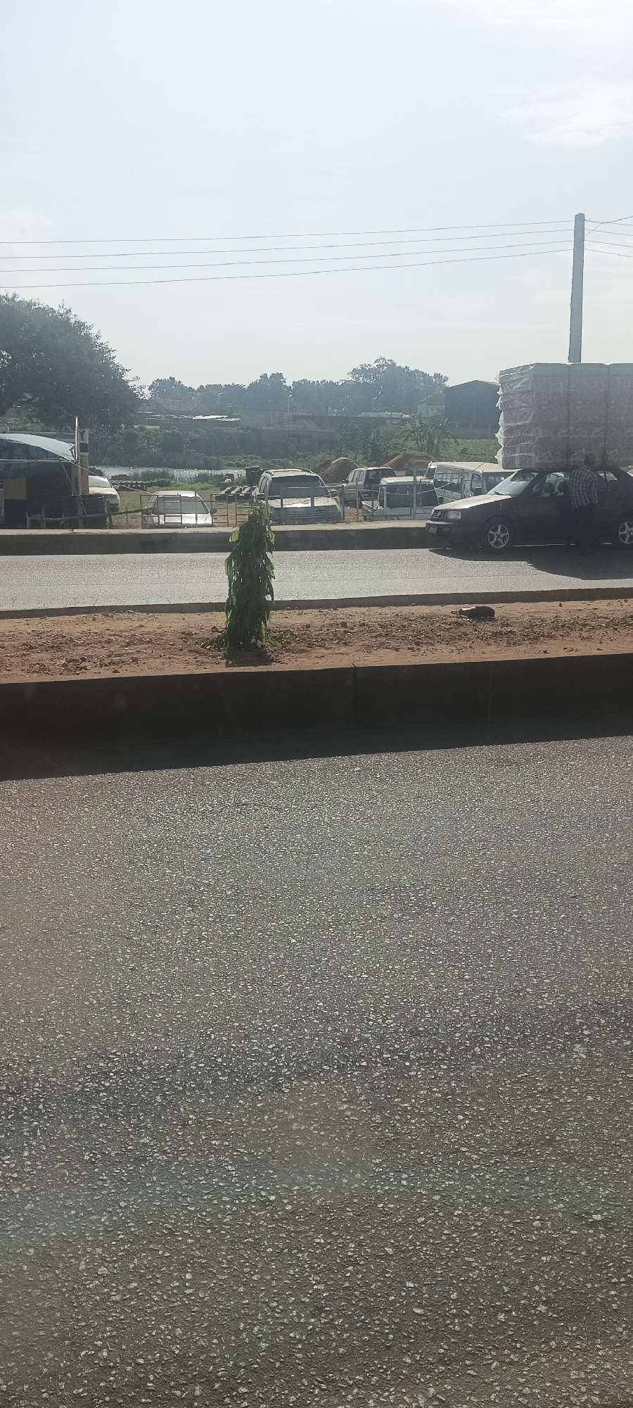 Morning street scenes documented in Bukuru, Nigeria show daily life
