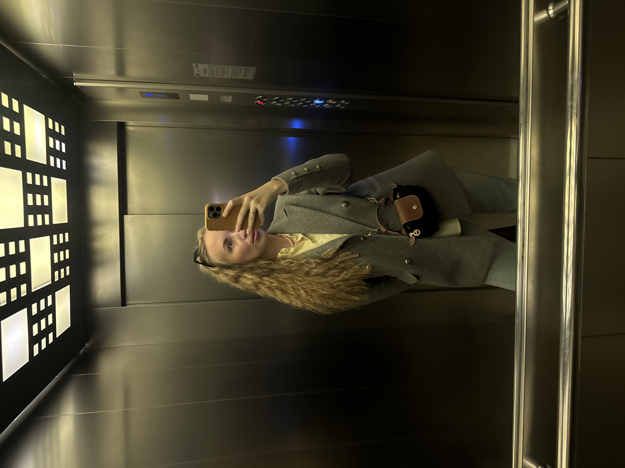 Person takes selfie in elevator in Sirius, Russia