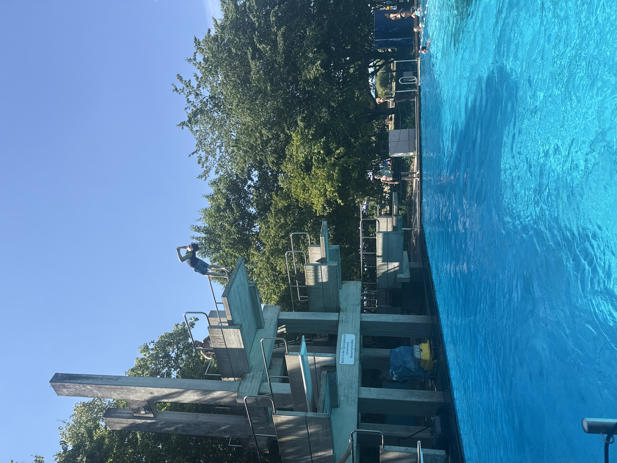 Summer afternoon at Rheinbach's outdoor pool diving tower