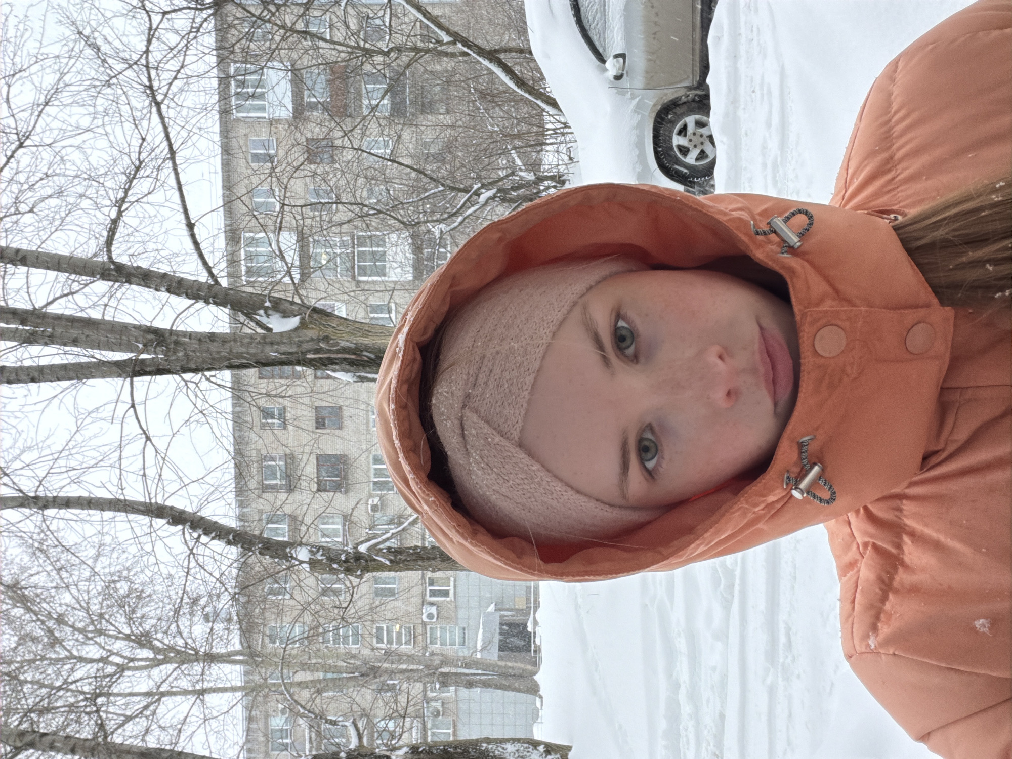 Woman photographed during snowfall in Berezniki, Russia