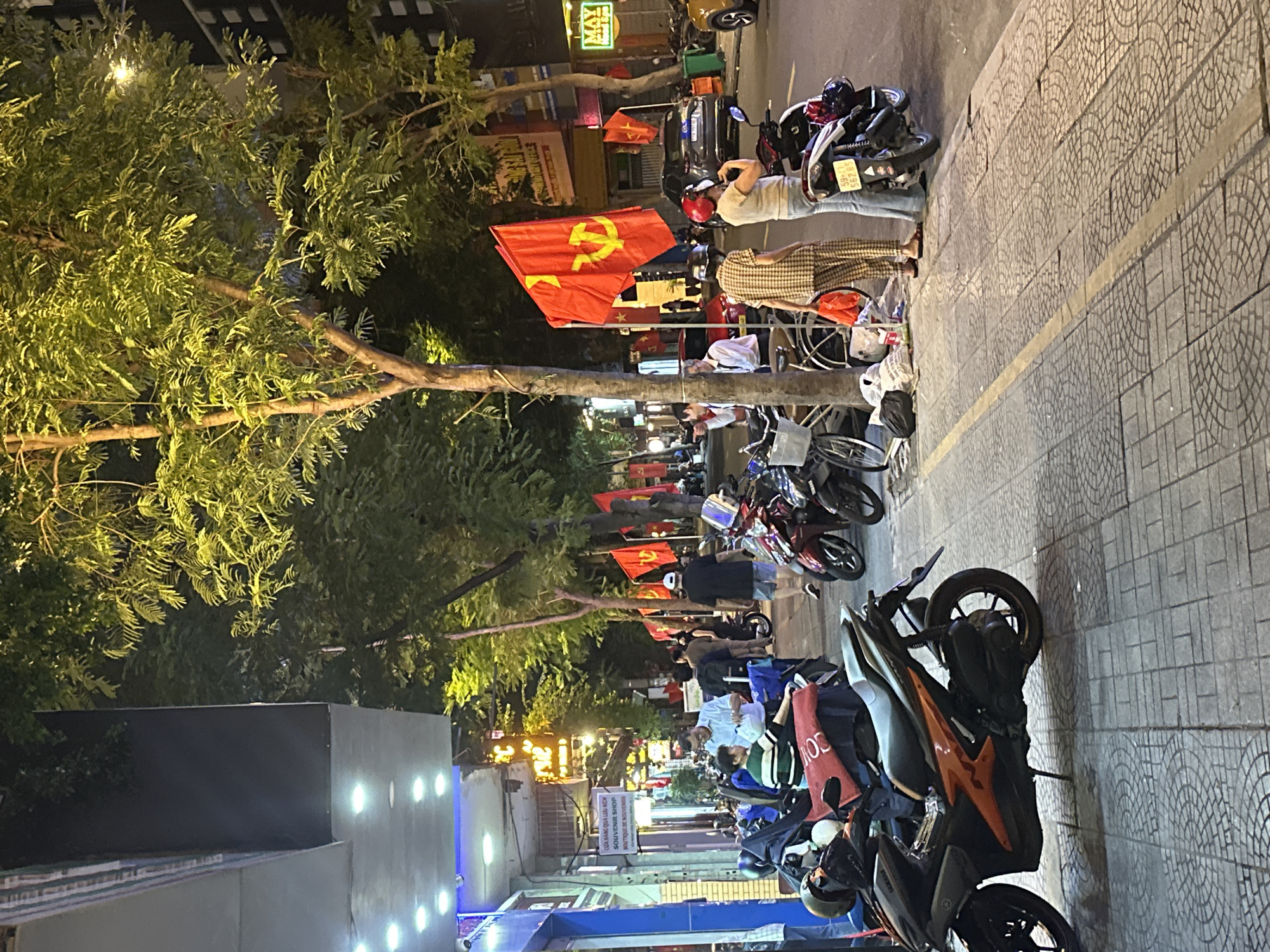 Thủ Đức nightlife: busy streets, neon signs, and motorbike traffic