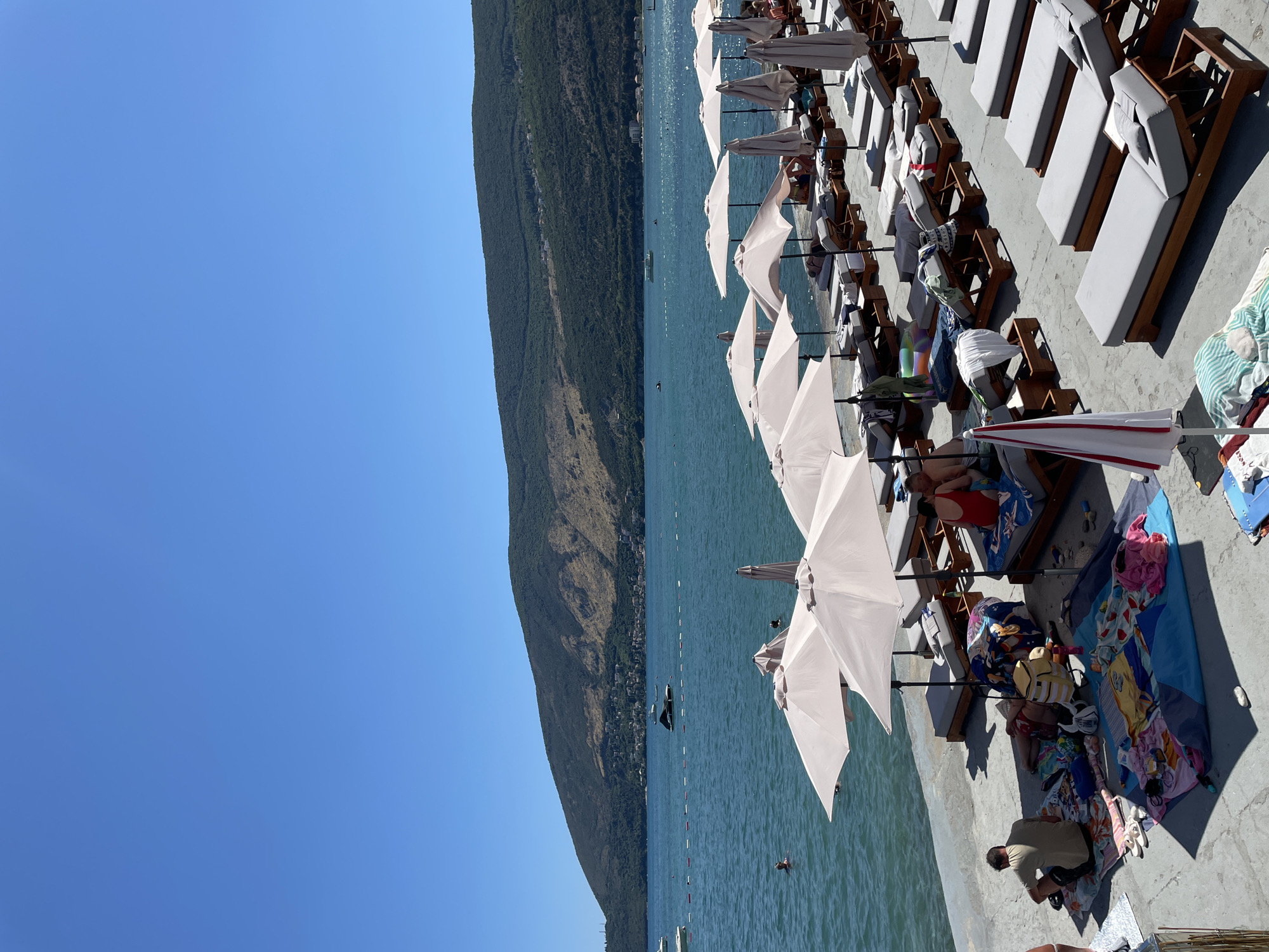 Busy summer afternoon on Igalo's waterfront pier
