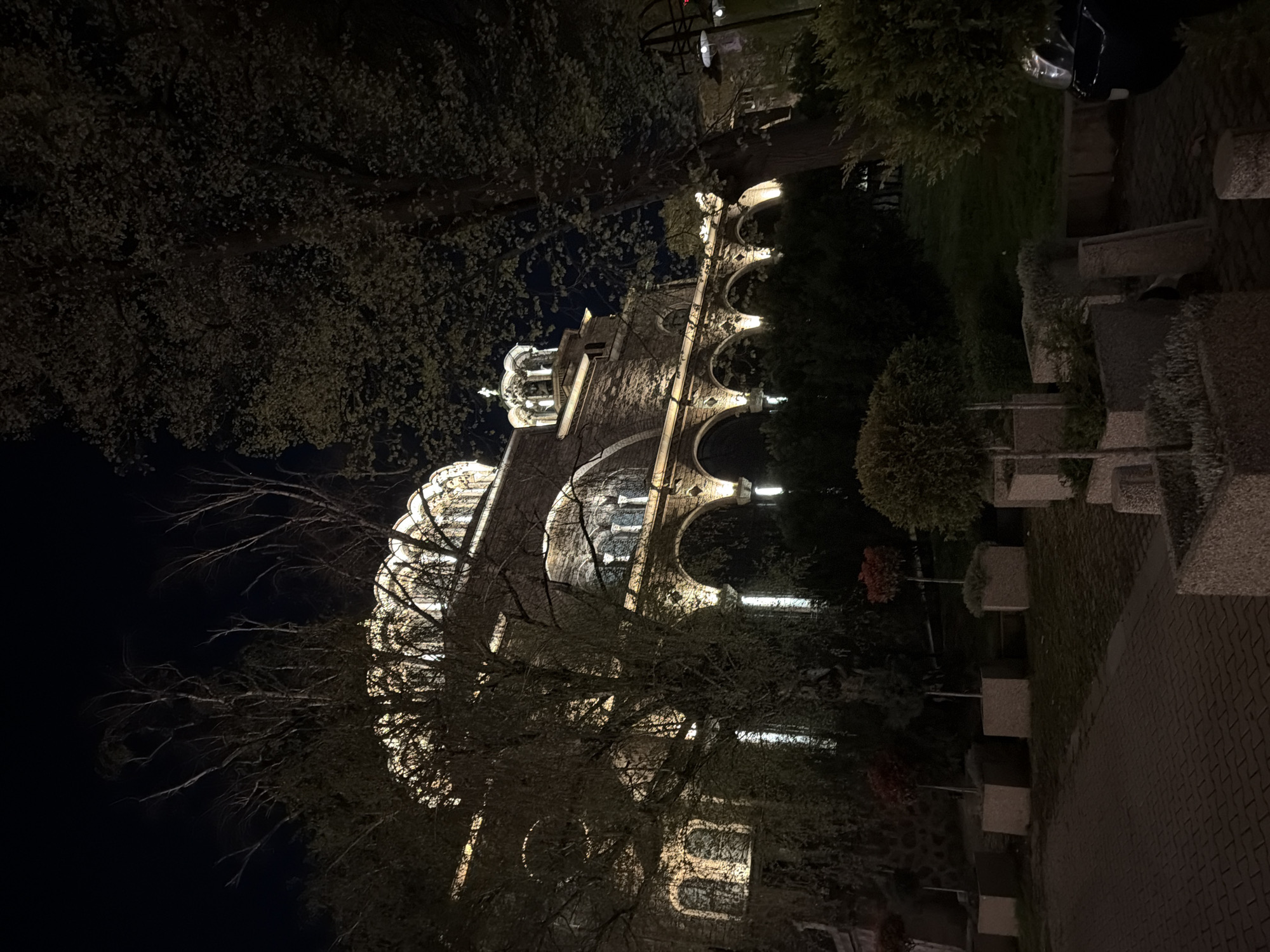 Historic illuminated building draws evening visitors to city park
