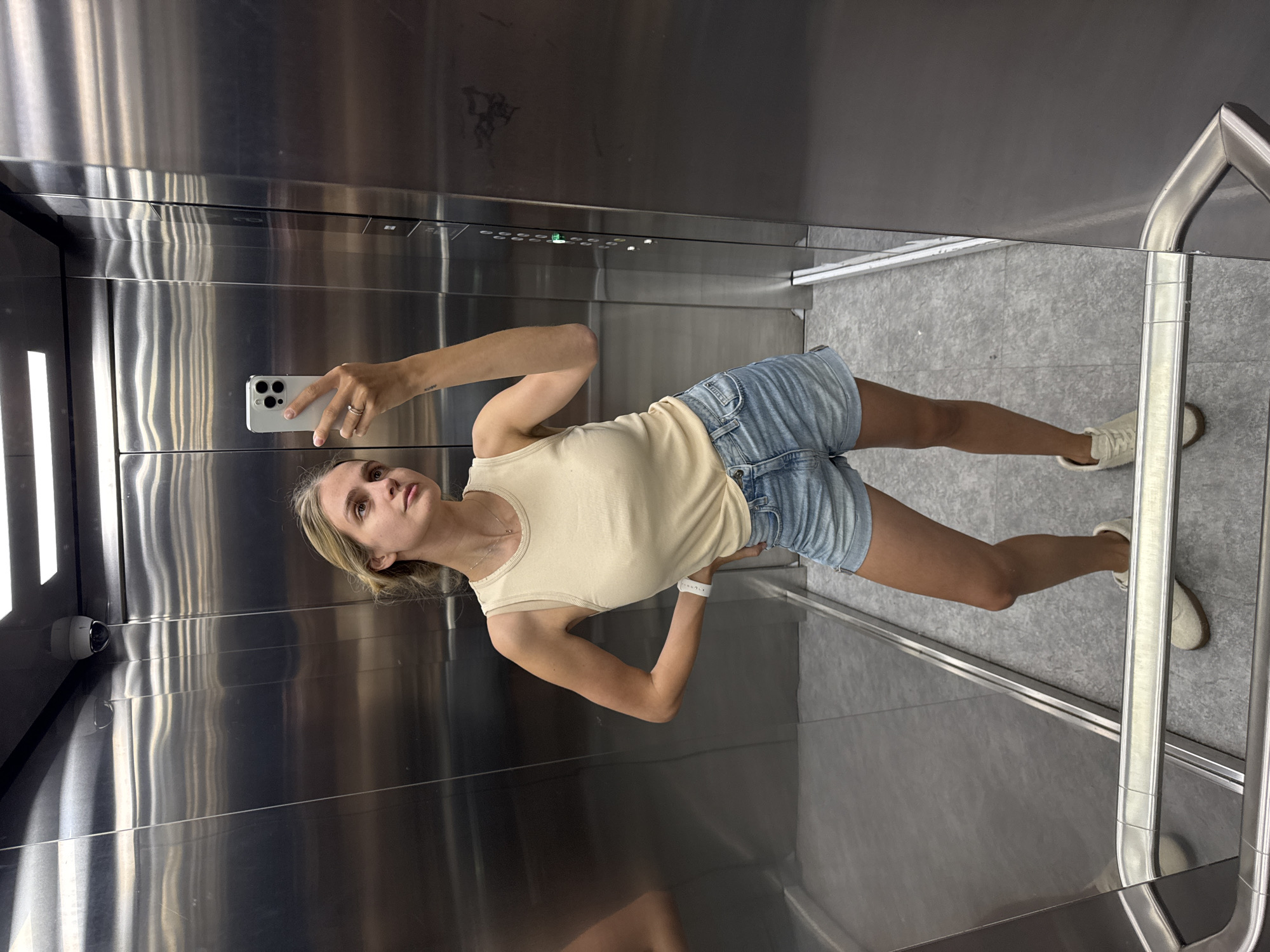 Woman takes selfie in elevator