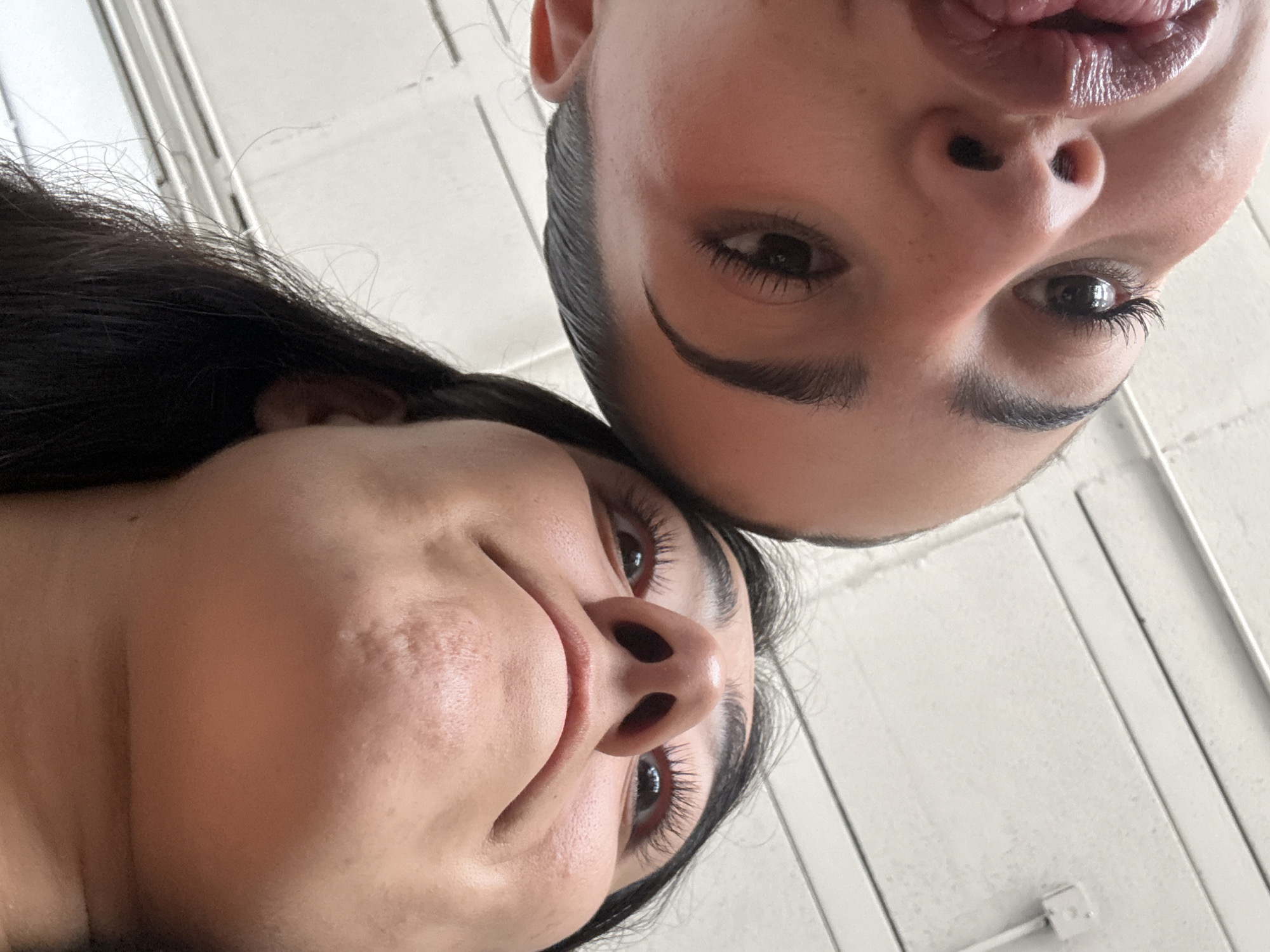 Two women photographed from below in Puebla, Mexico