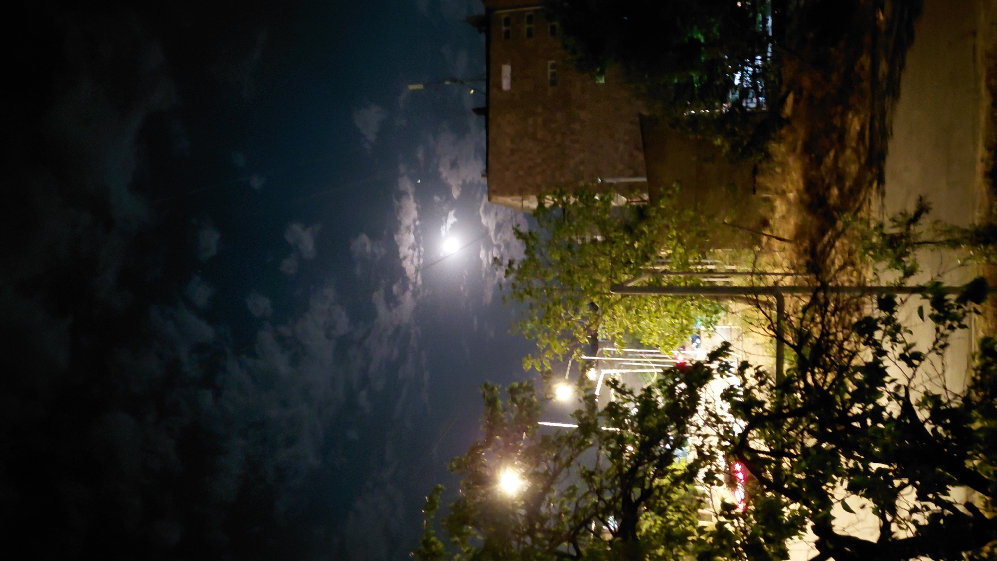 Full moon rising over Abovyan's streets on a summer night