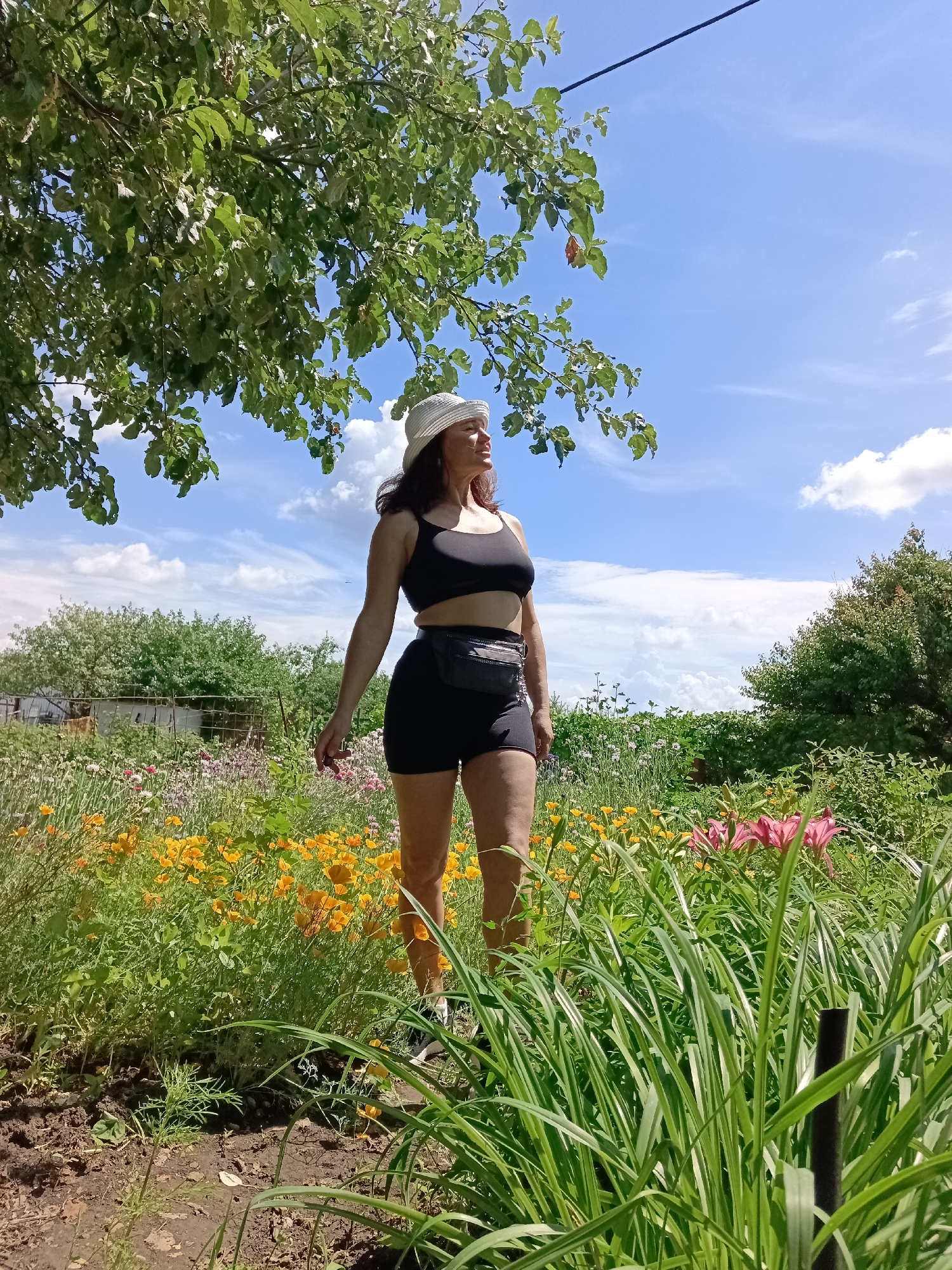 Garden workout session on a bright summer morning in Vyazovka