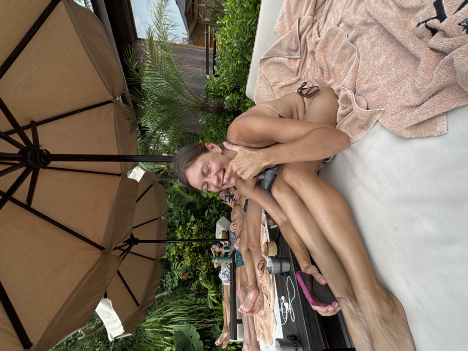 Women enjoy poolside leisure time at Canggu resort