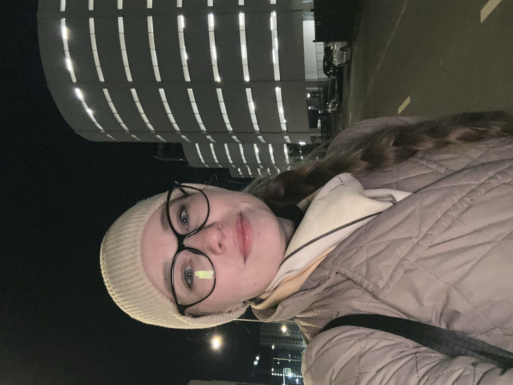 Woman documented during evening stroll through Saint Petersburg streets