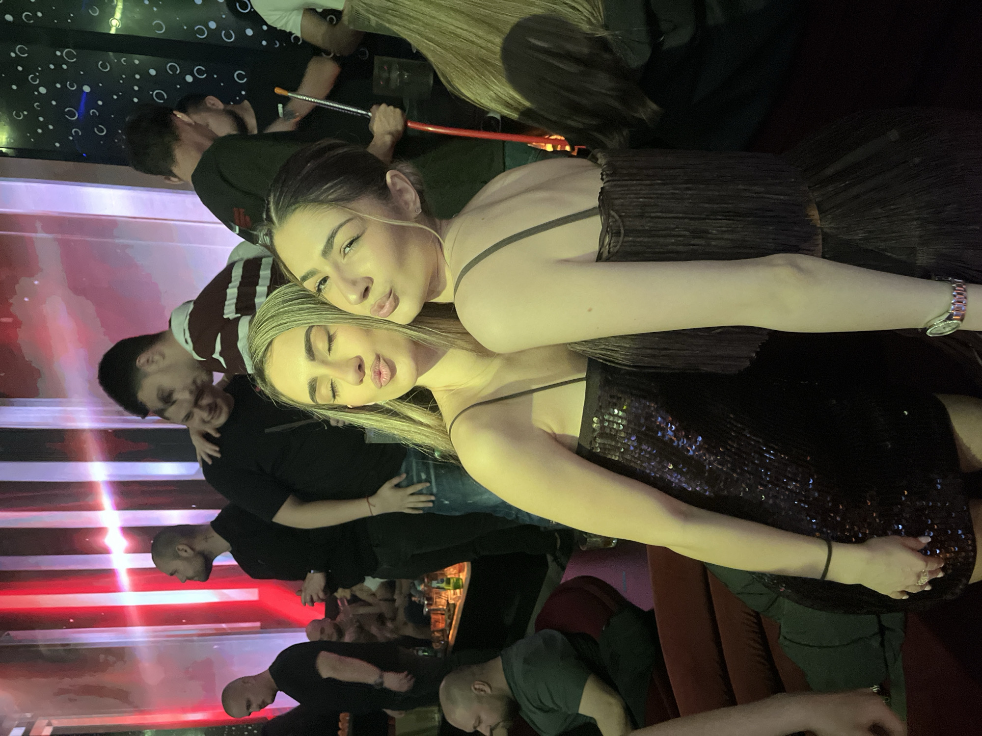 Women celebrate with champagne at Burgas nightlife venue