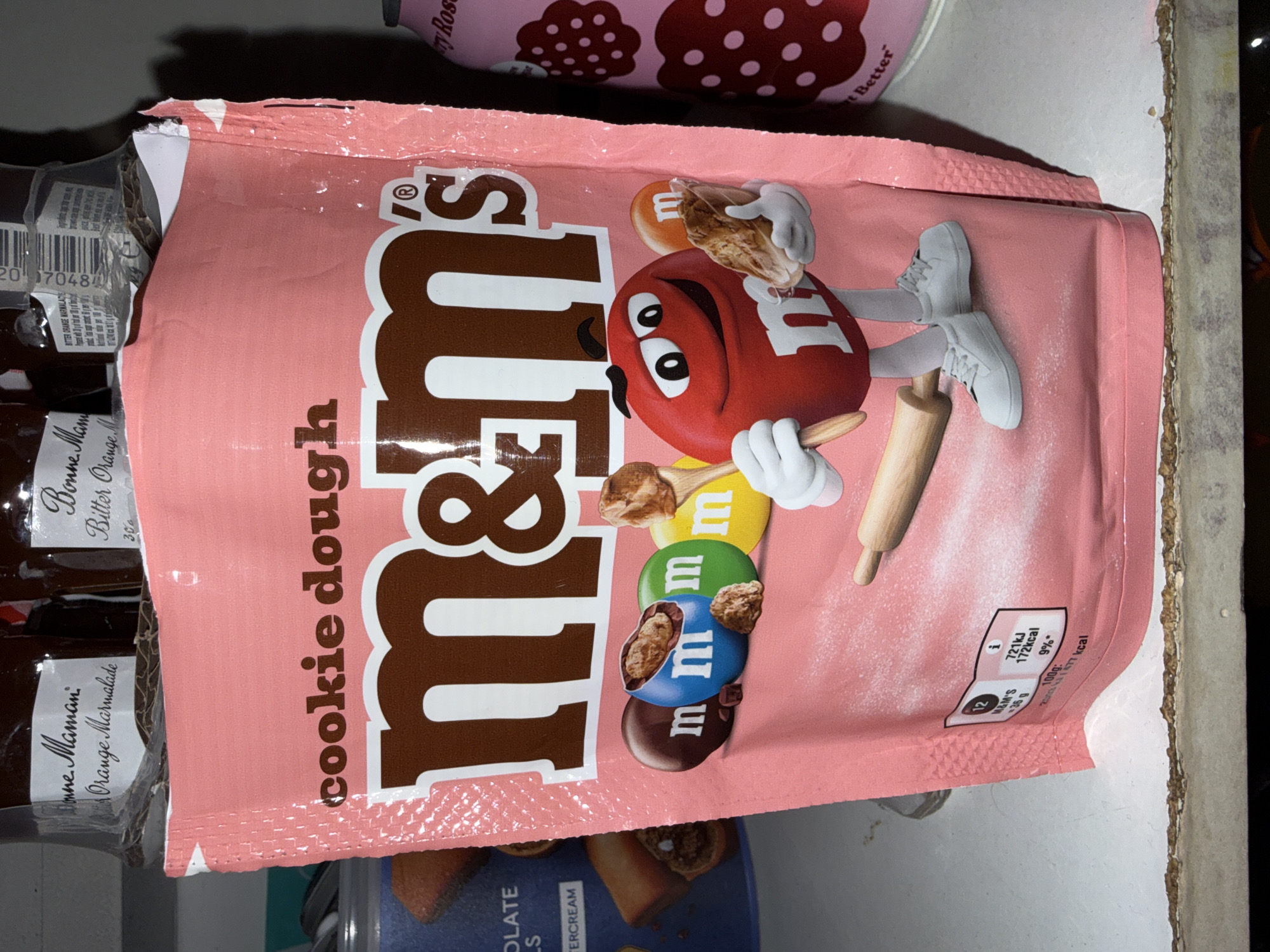 Pink M&M's package spotted among food display in London