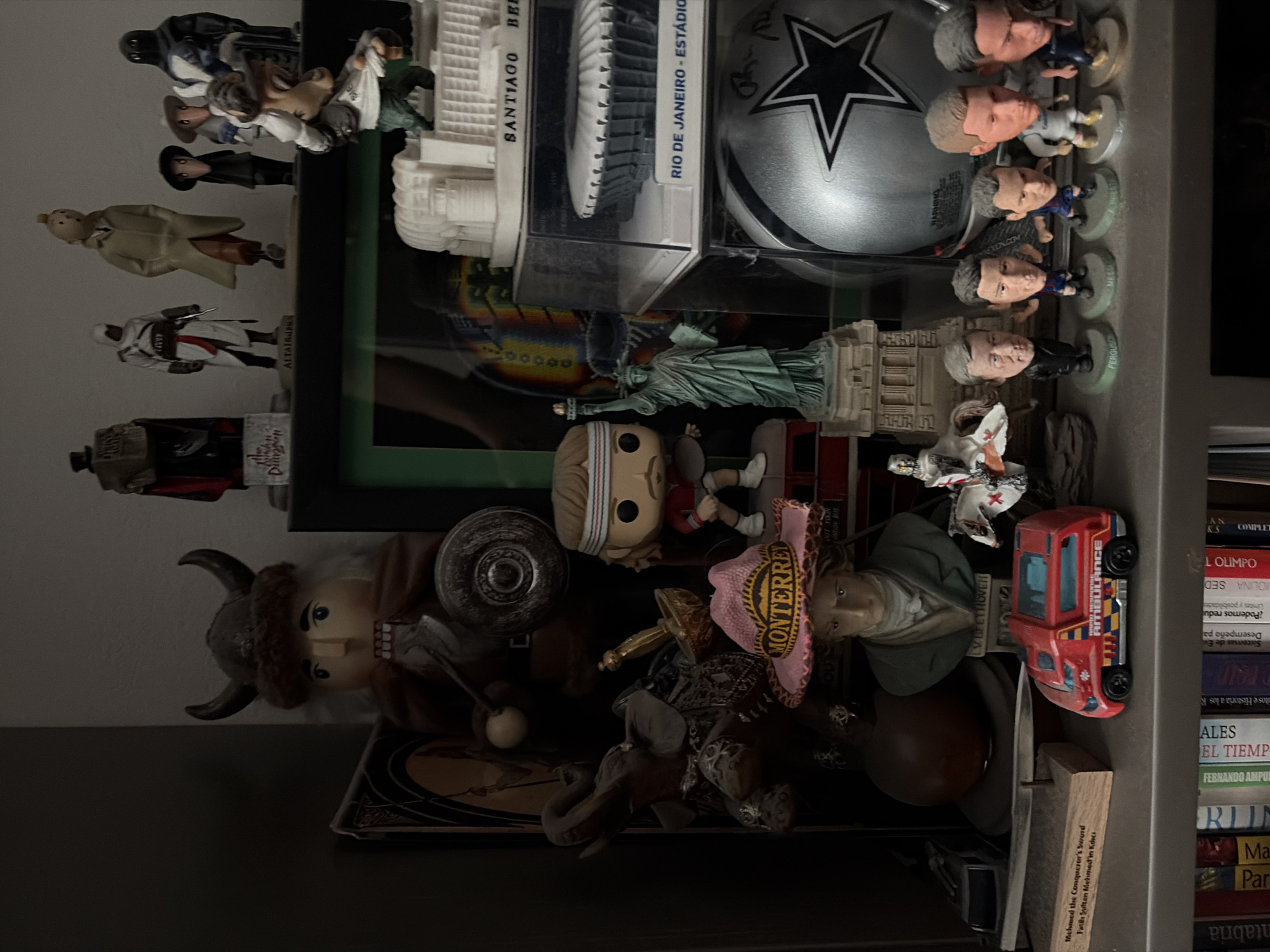 Personal collectibles shelf documented in Mexico City home