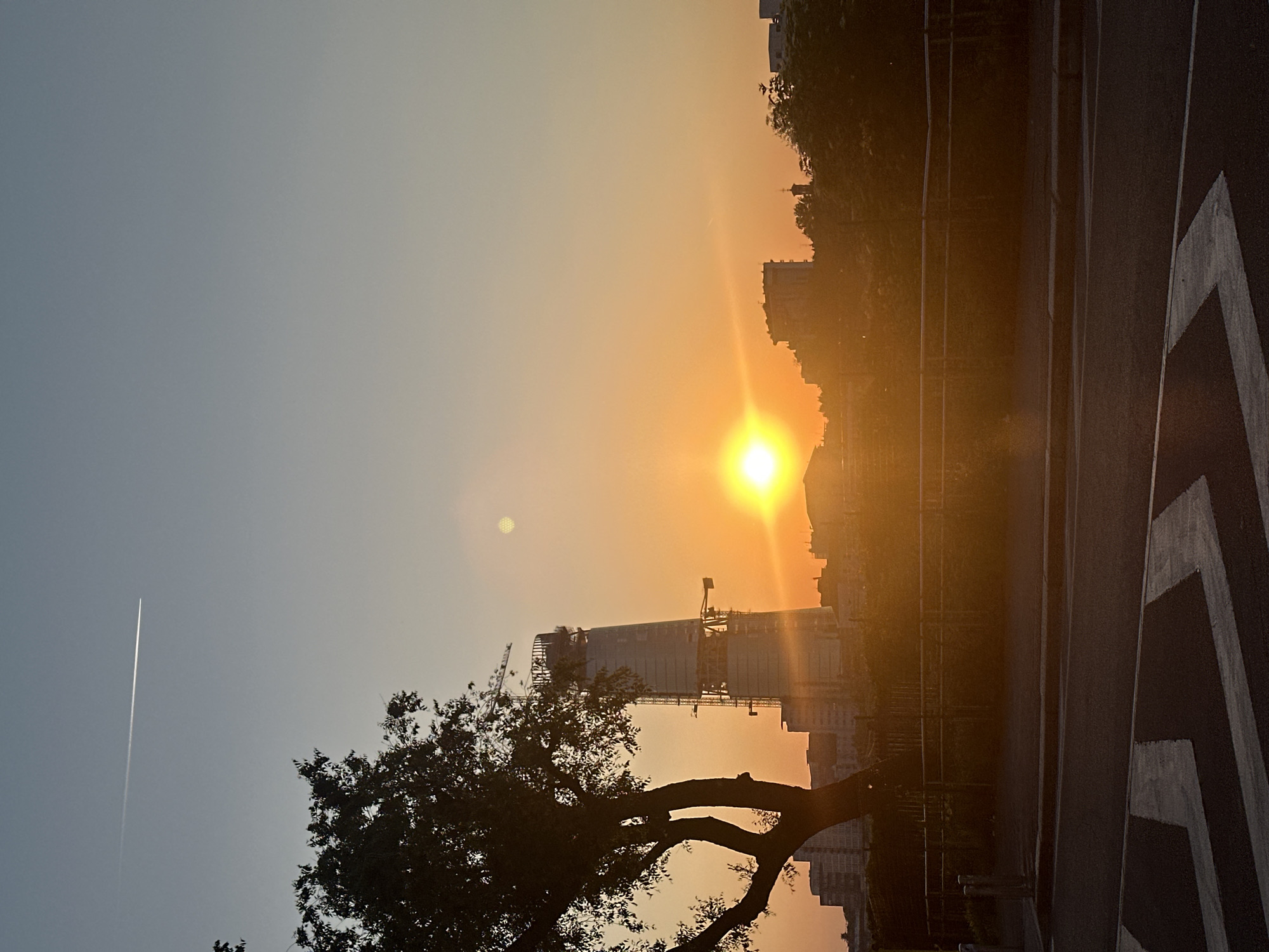 Witness captures Milan sunset with warm urban lighting
