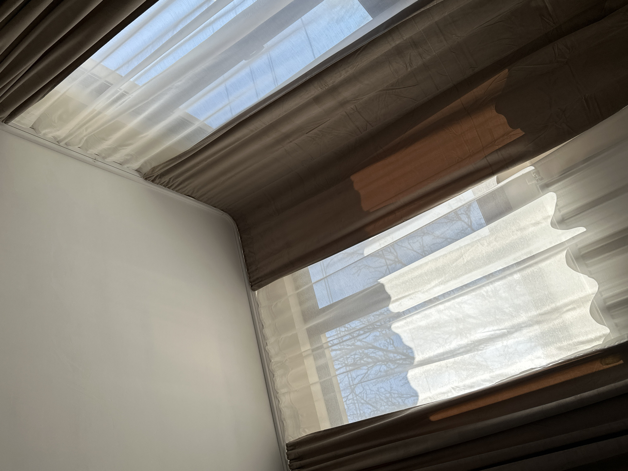 Room interior with layered curtains documented in Galiche, Bulgaria
