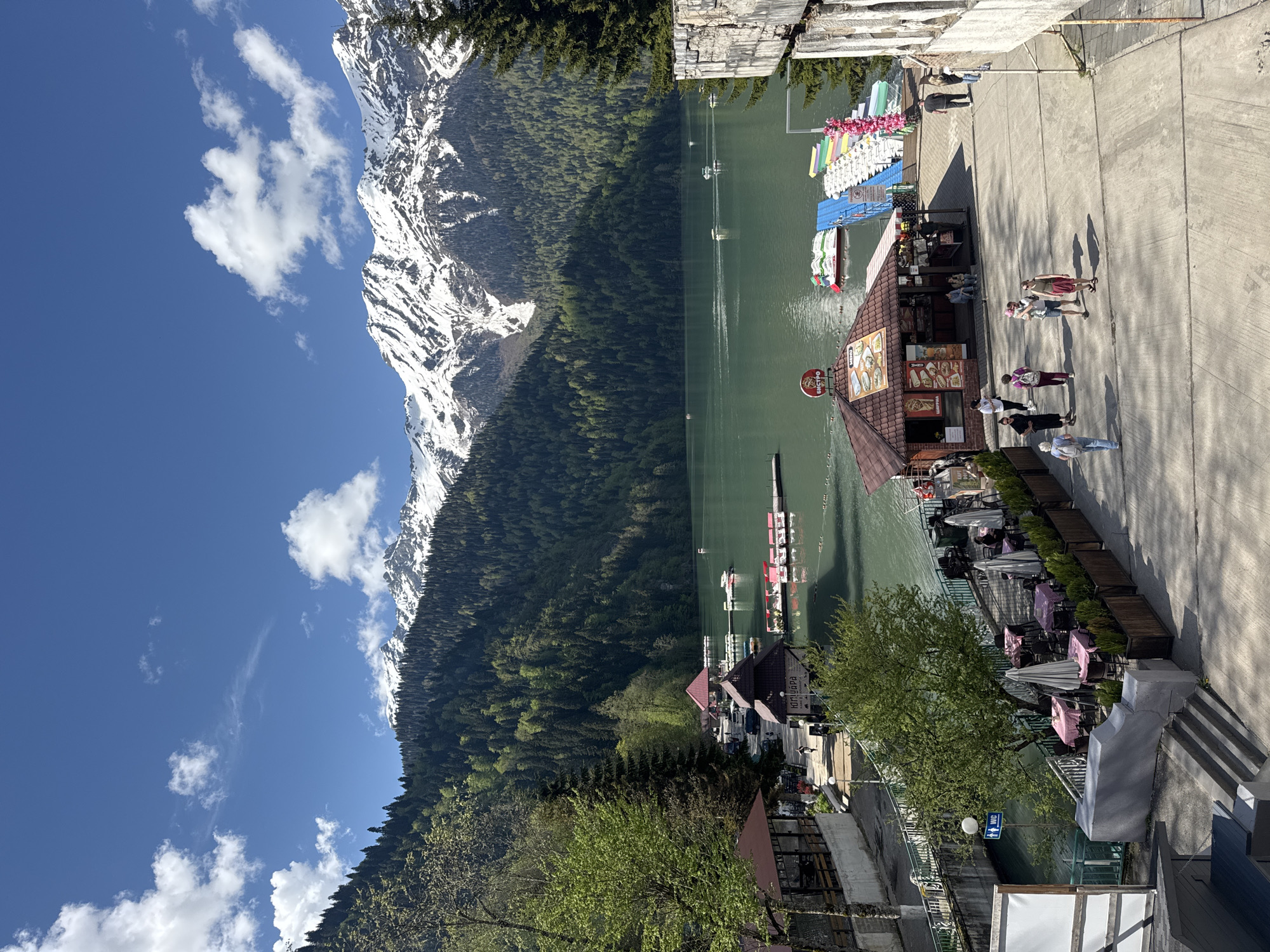 Visitor documents scenic Lake Ritsa views in Abkhazia