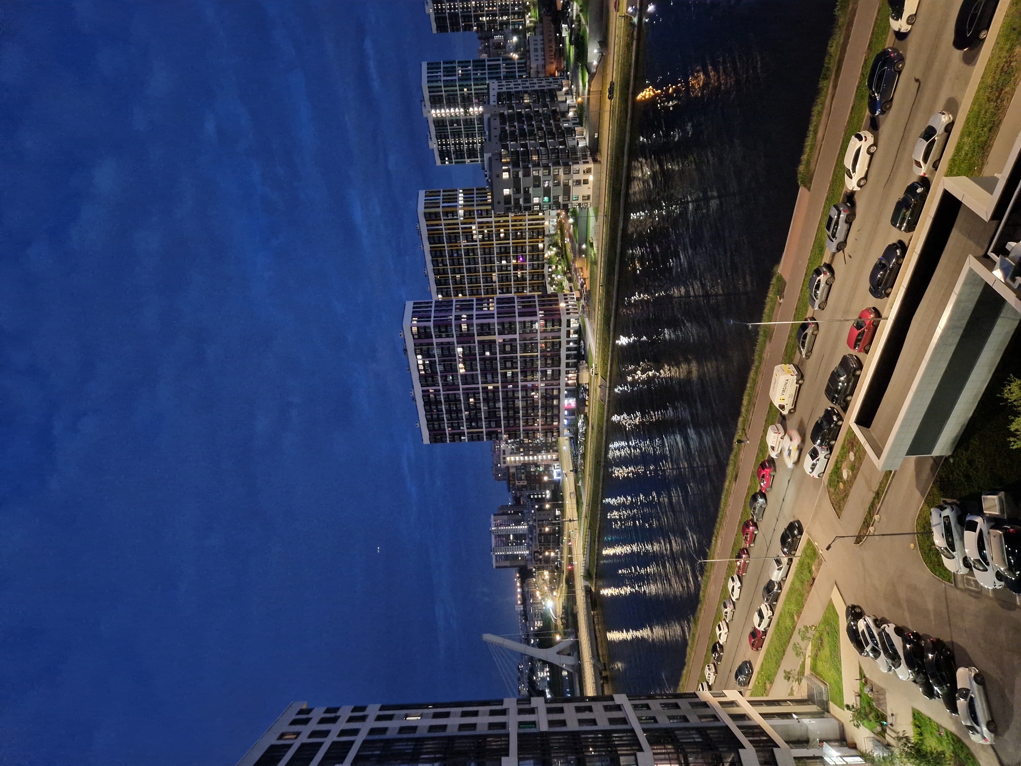 City waterfront dusk views paired with a cozy fireplace balcony
