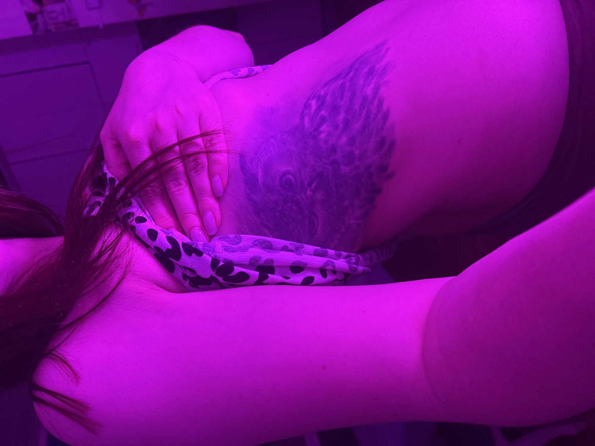 Woman photographed in leopard print with tattoos in Russia