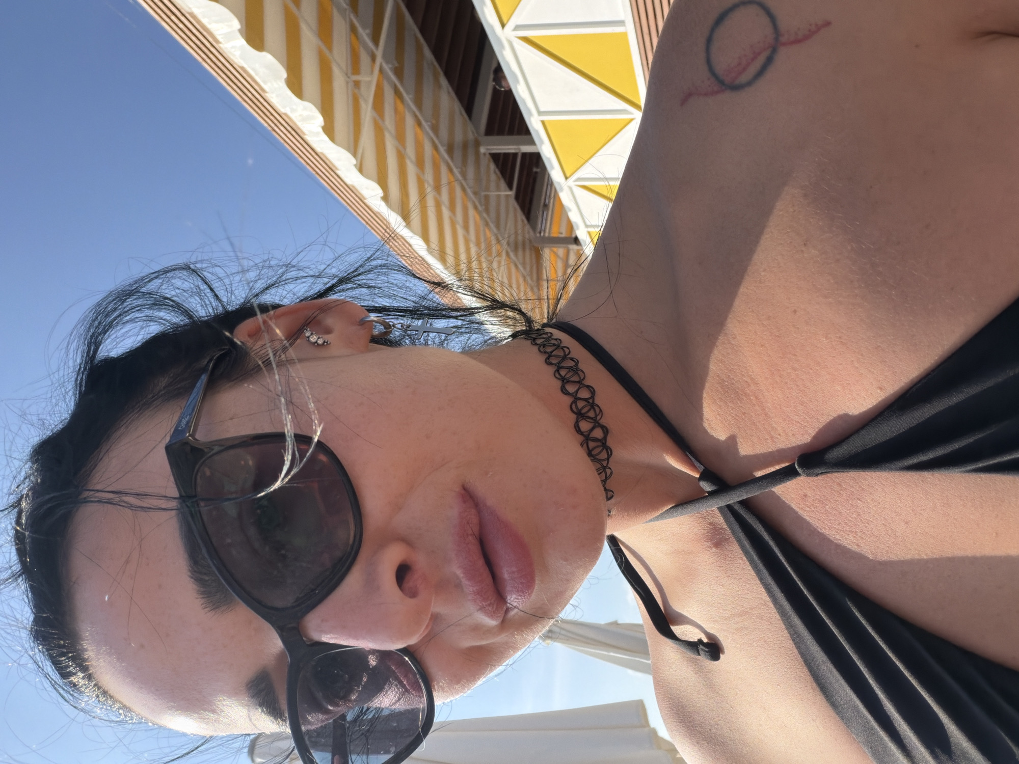 Woman takes selfie in black bikini in Shepsi, Russia