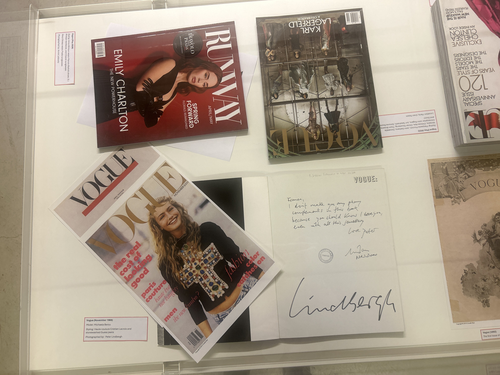 Fashion magazine display featuring Vogue observed at Milan exhibition