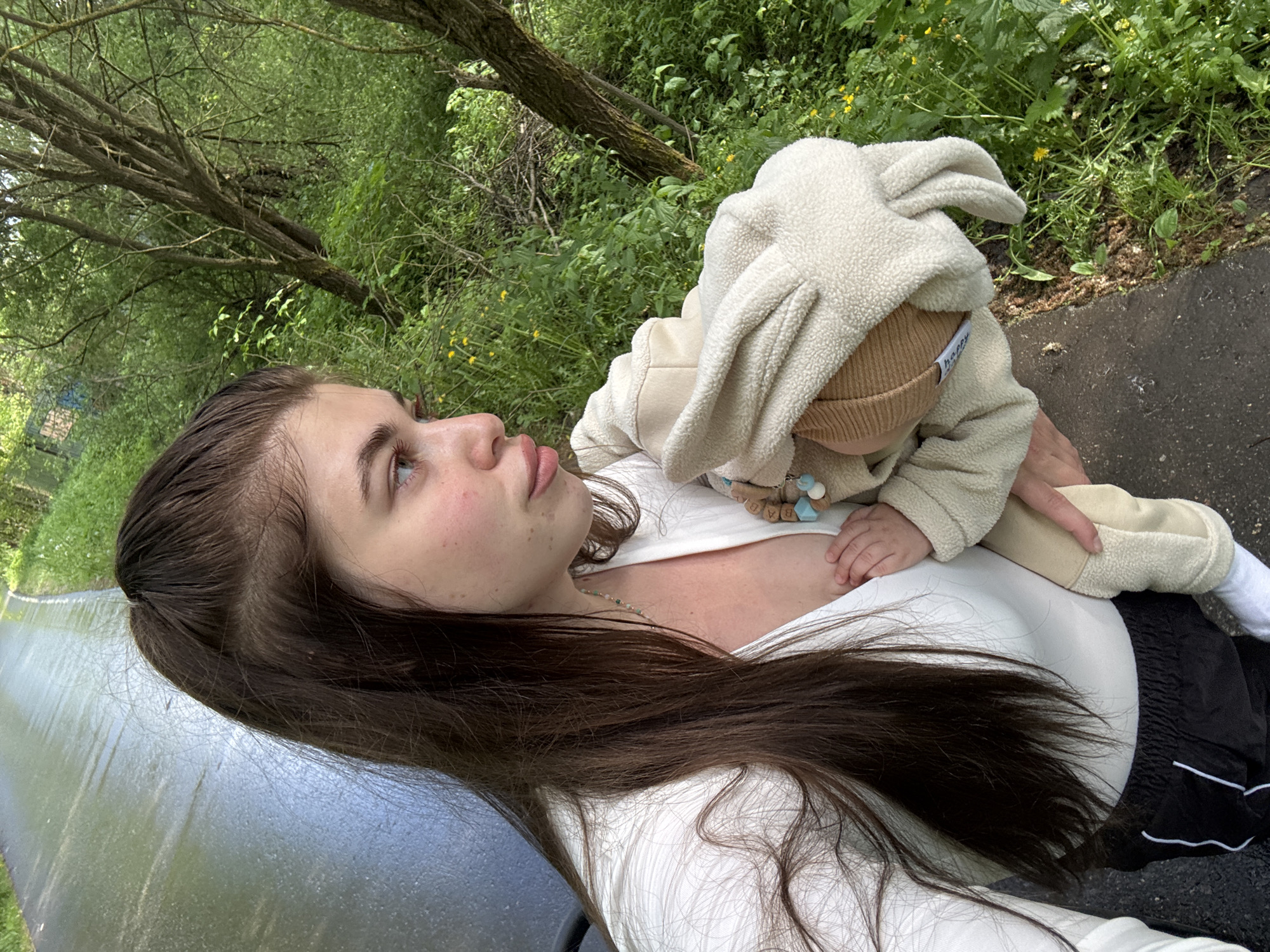 Mother and baby enjoy spring walk in Russian park