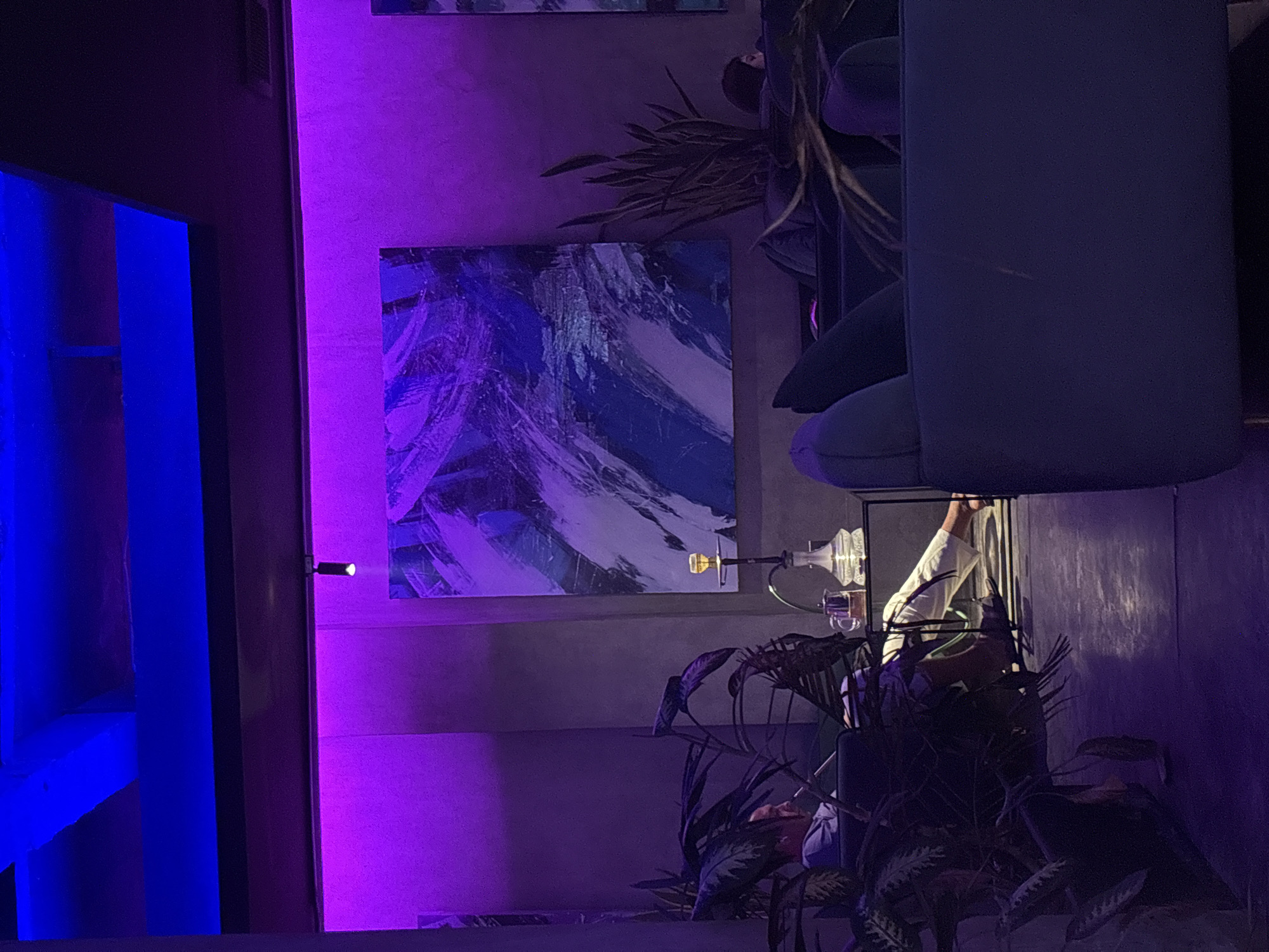 Hookah lounge interior documented in Indonesia with neon lighting
