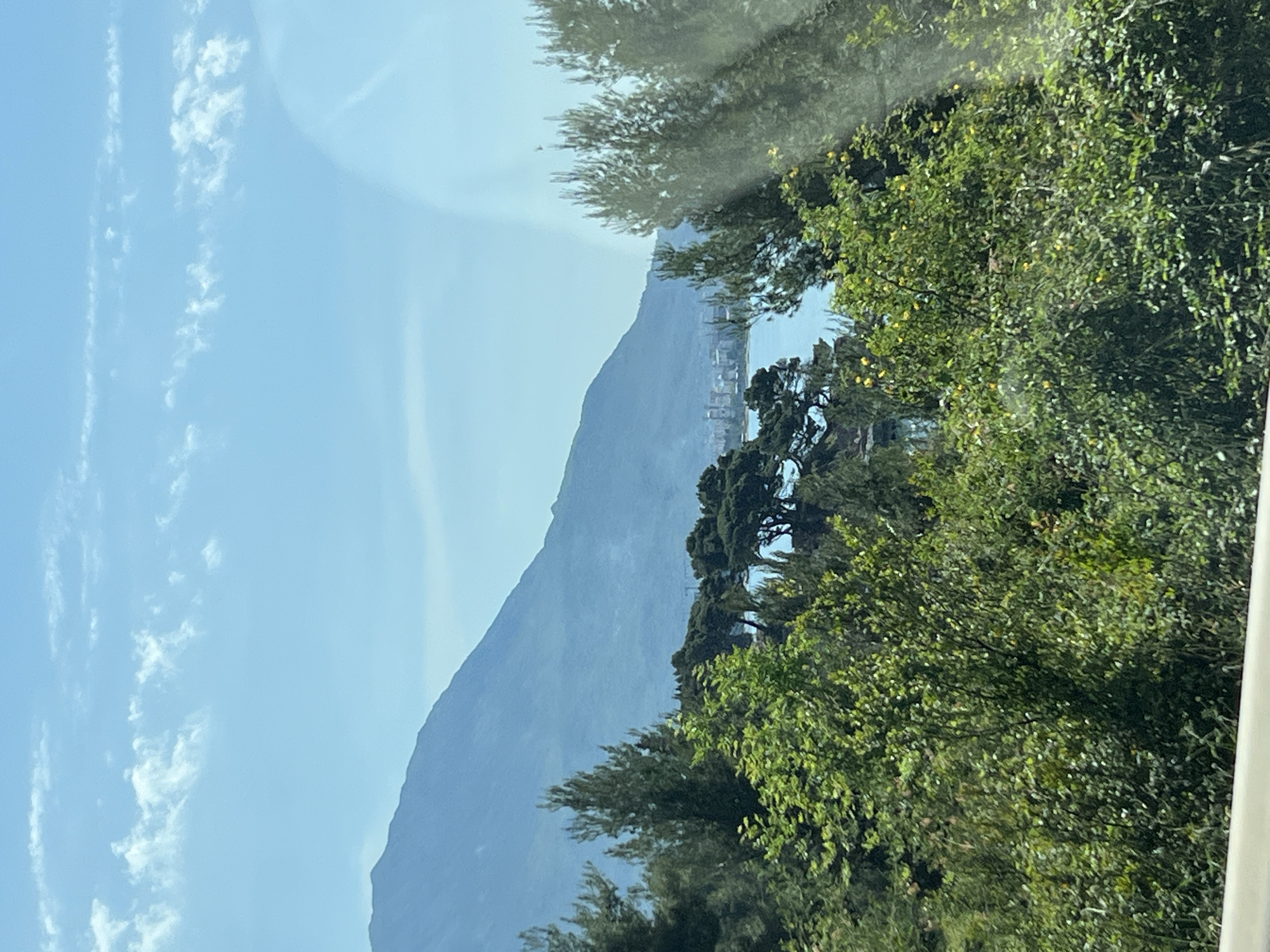 Coastal mountain view photographed through window in Sutomore
