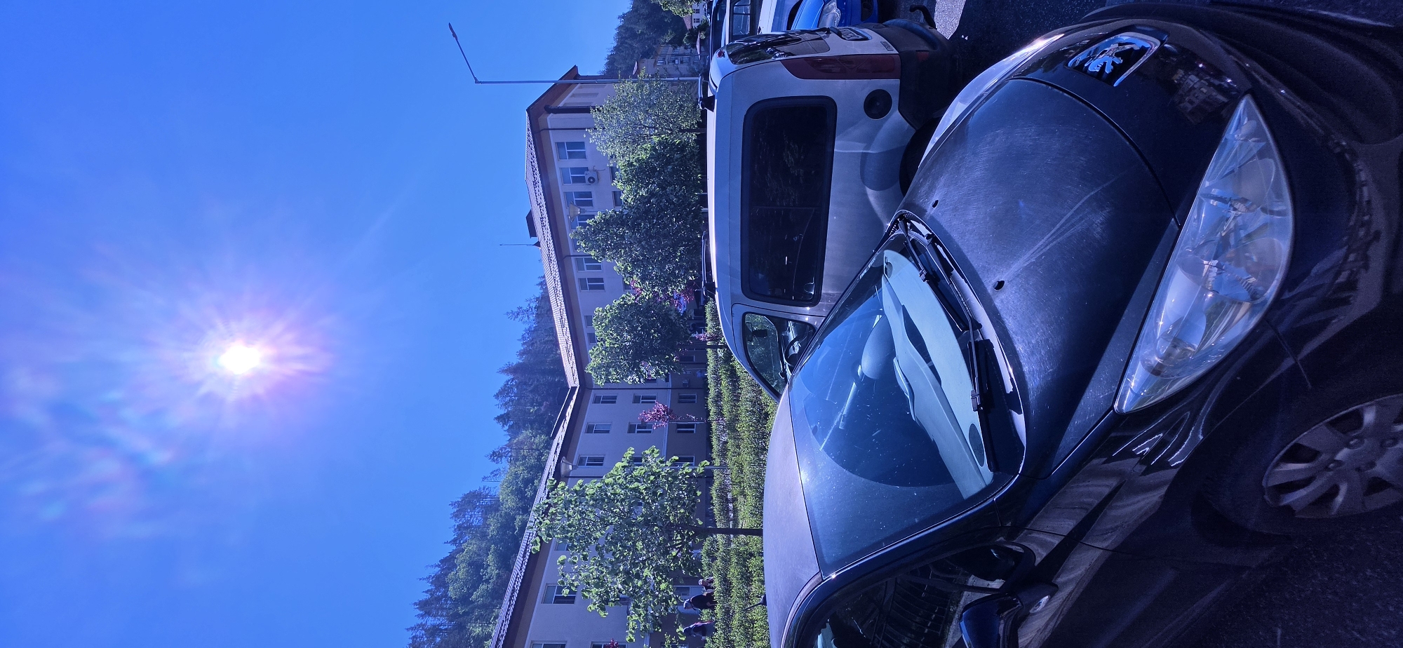 Morning scenes documented in Madan, Bulgaria including buildings and vehicles