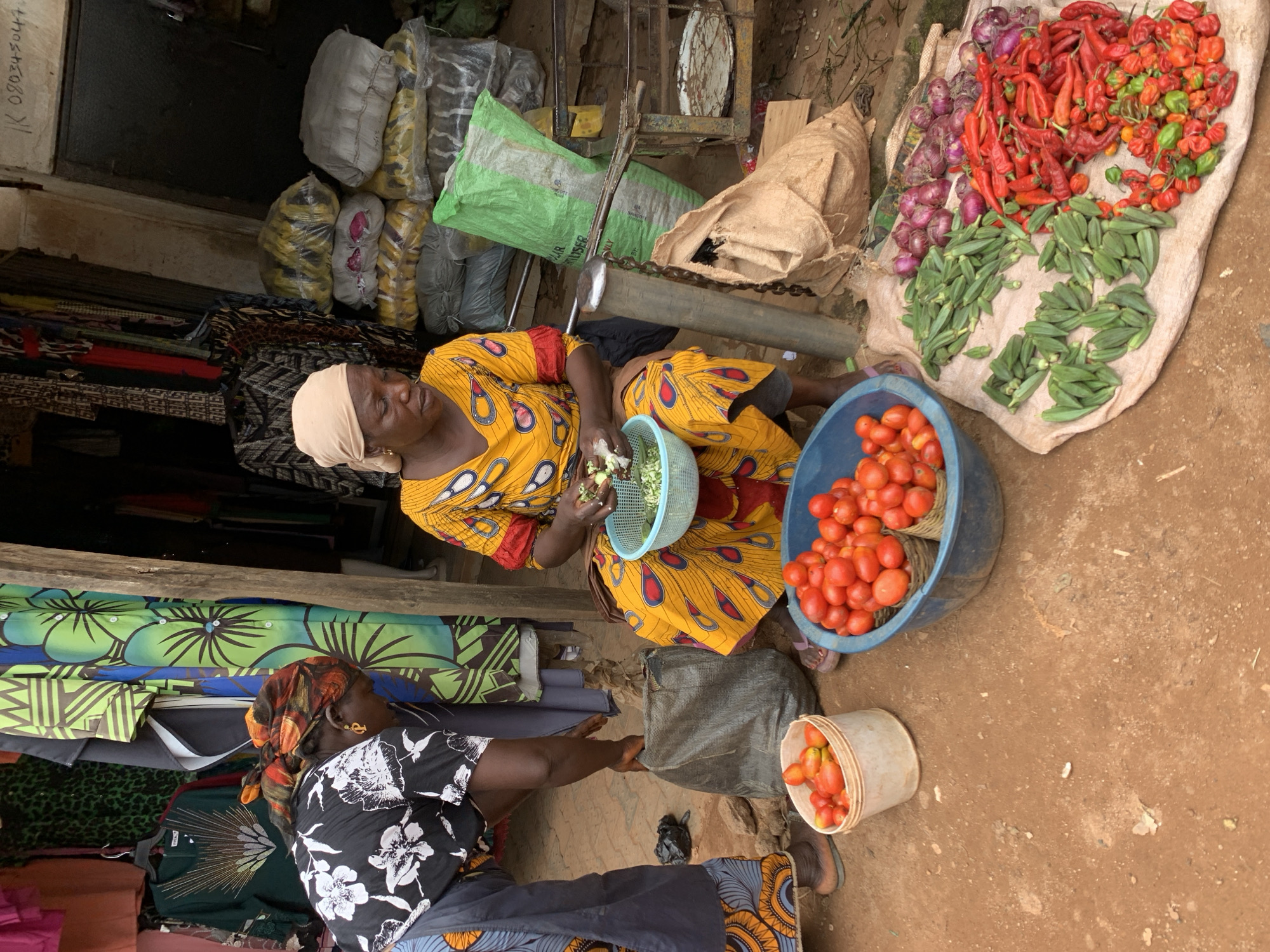 Street and market life along a commercial corridor in Jos, Nigeria