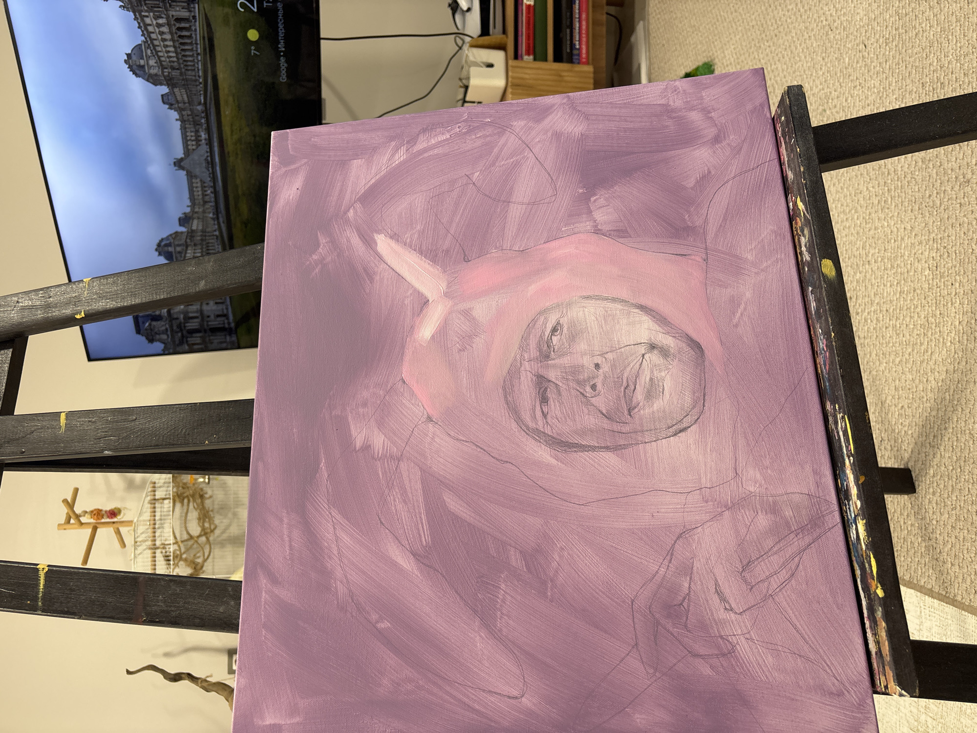 Artist paints portrait while cockatiel watches in Krasnoyarsk studio
