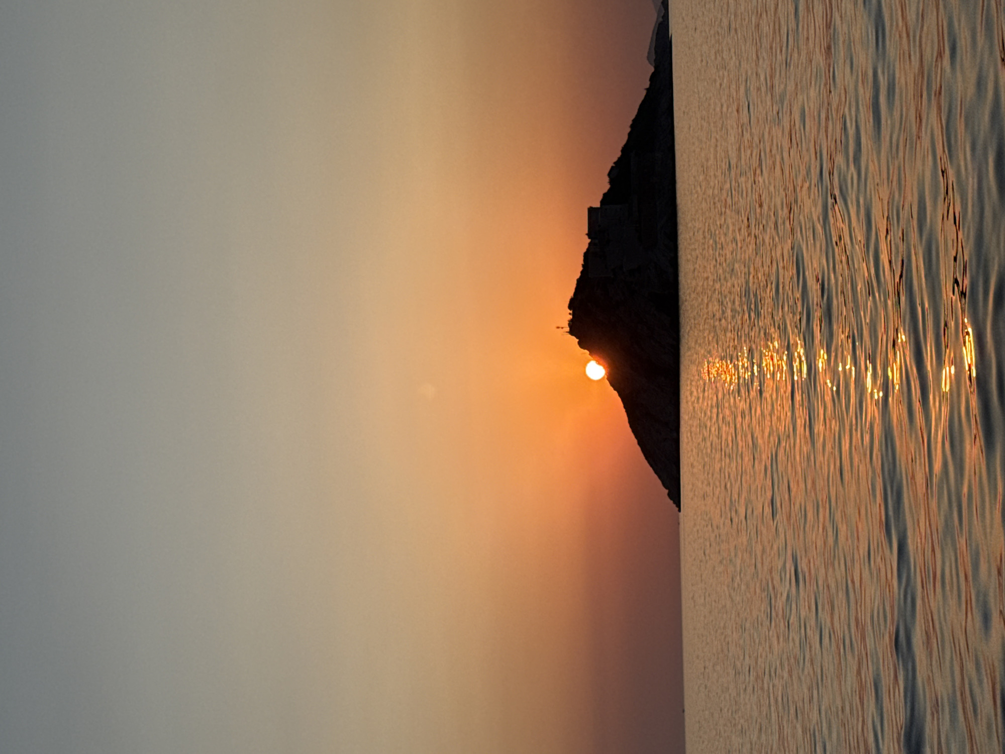 Adriatic sunset behind a silhouetted island, Mirišta
