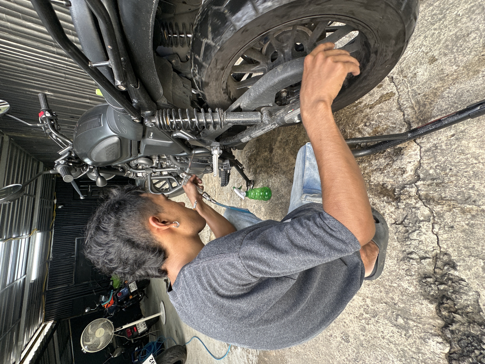 Motorcycle wash day at a Karon garage
