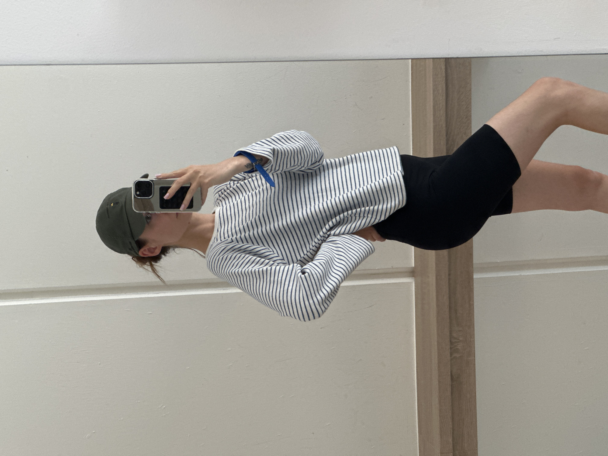 Woman takes selfies in building corridor in Kiel, Germany