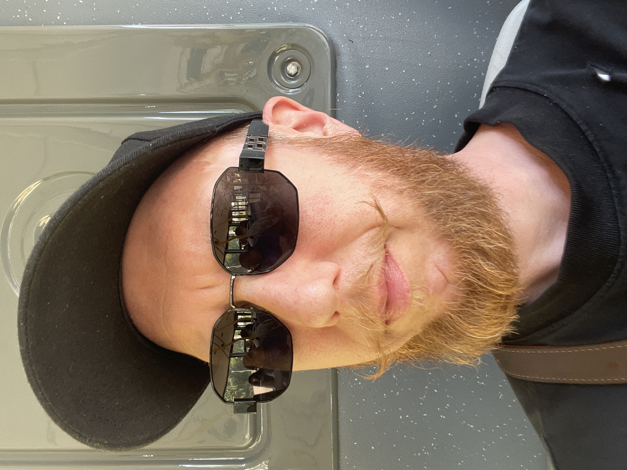 Close-up portrait with black cap and reflective sunglasses, St. Petersburg
