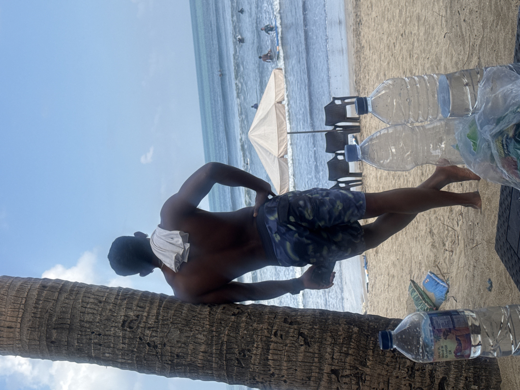 Kuta Beach in full swing: surfers, strollers, and shoreline life