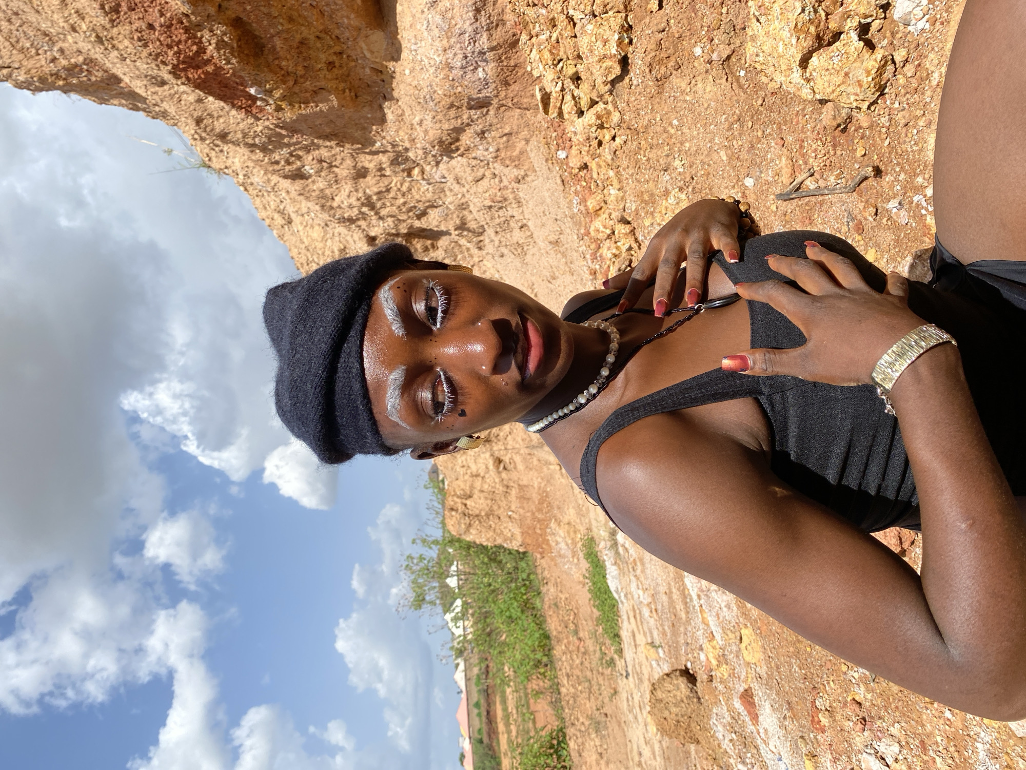 Portrait session against rocky terrain in Barakin Sabawa, Nigeria