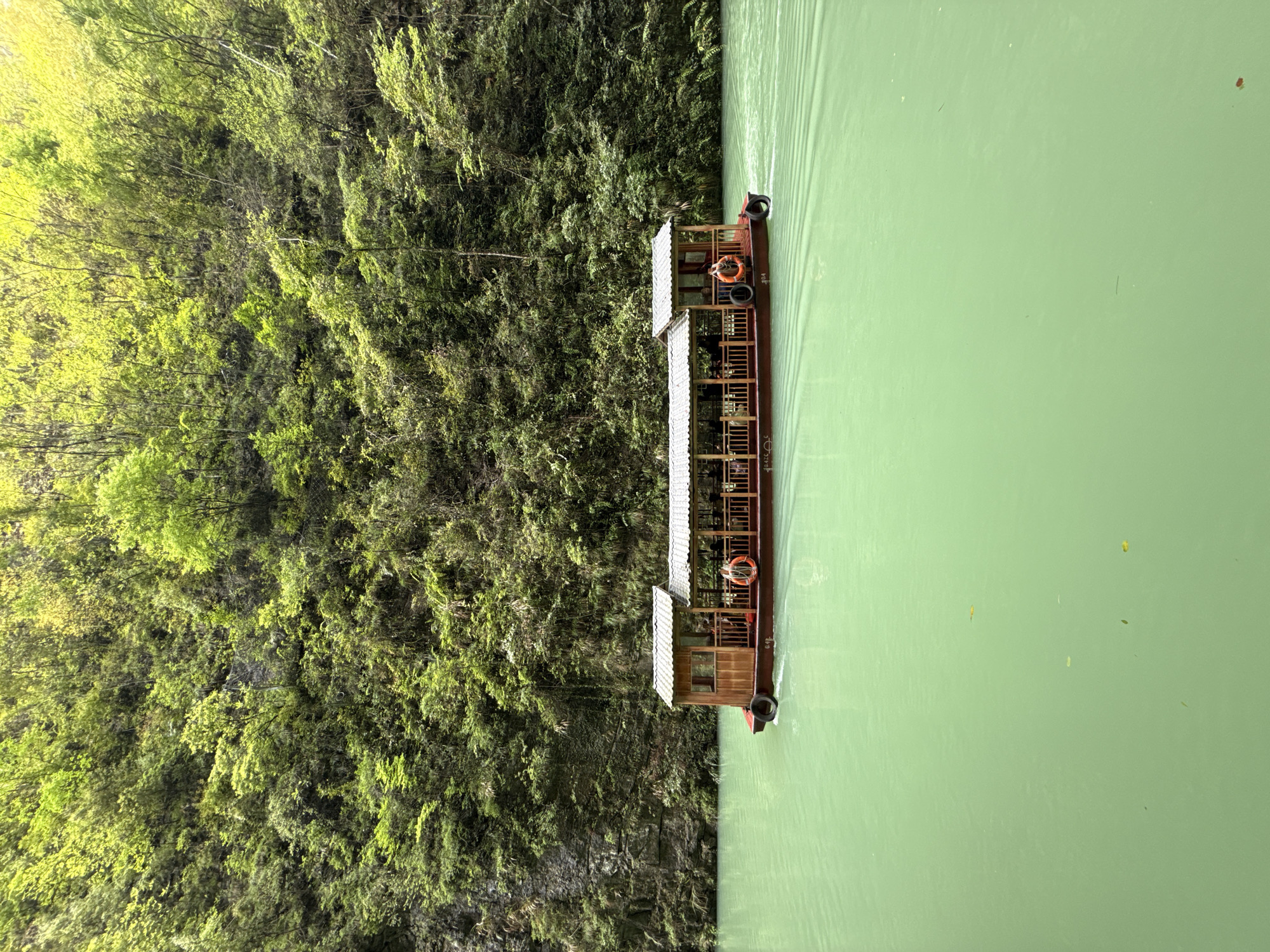 Tourist boat tours scenic Baofeng Lake Waterfall in Zhangjiajie