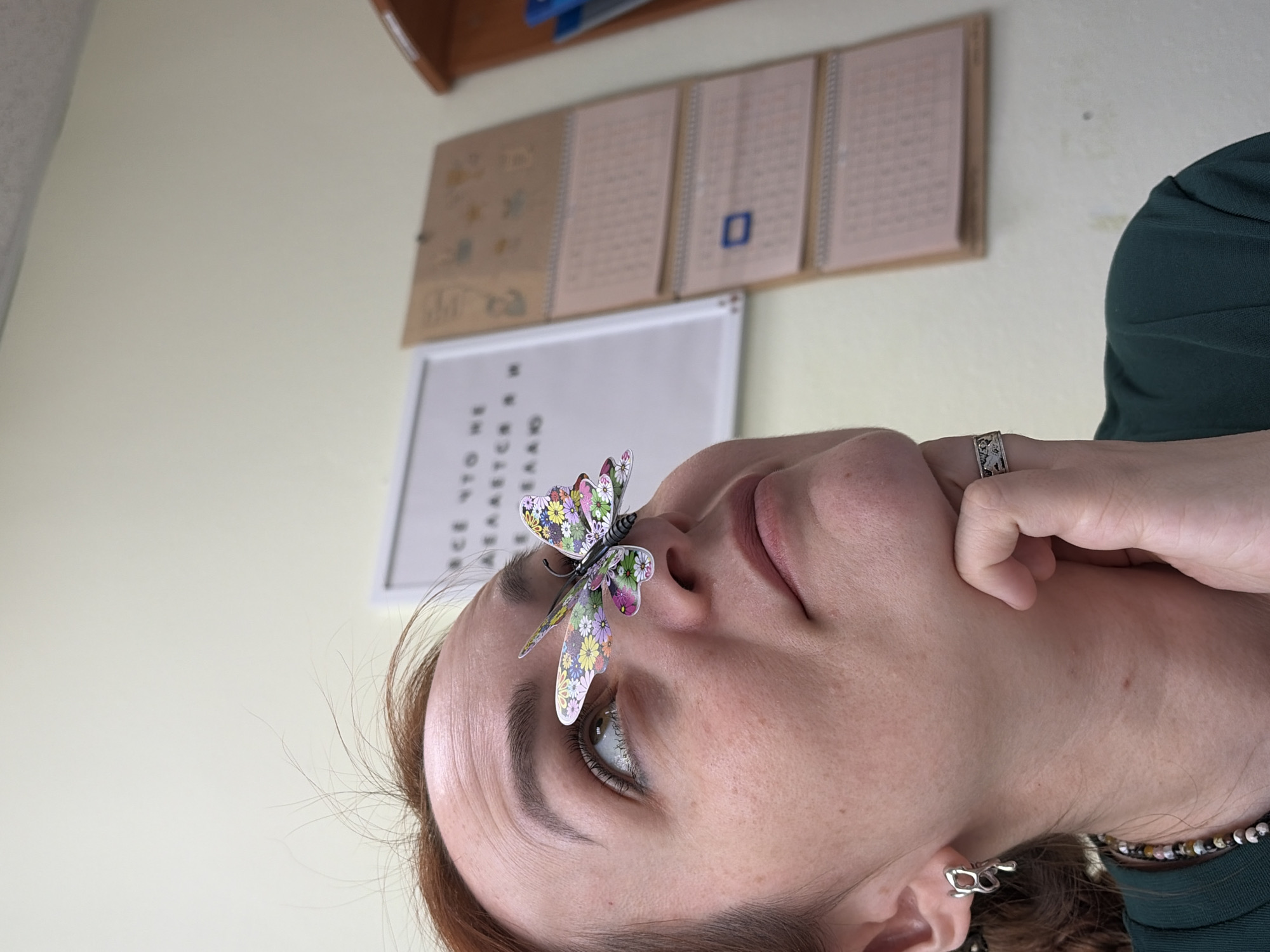 Woman poses for photos with butterfly decorations in Russia