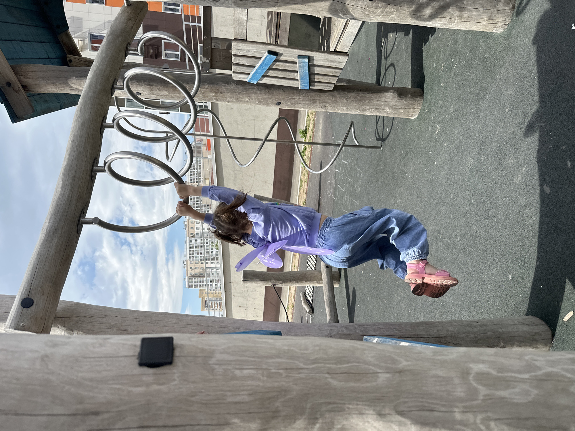Child plays on climbing structure at Khabarovsk playground