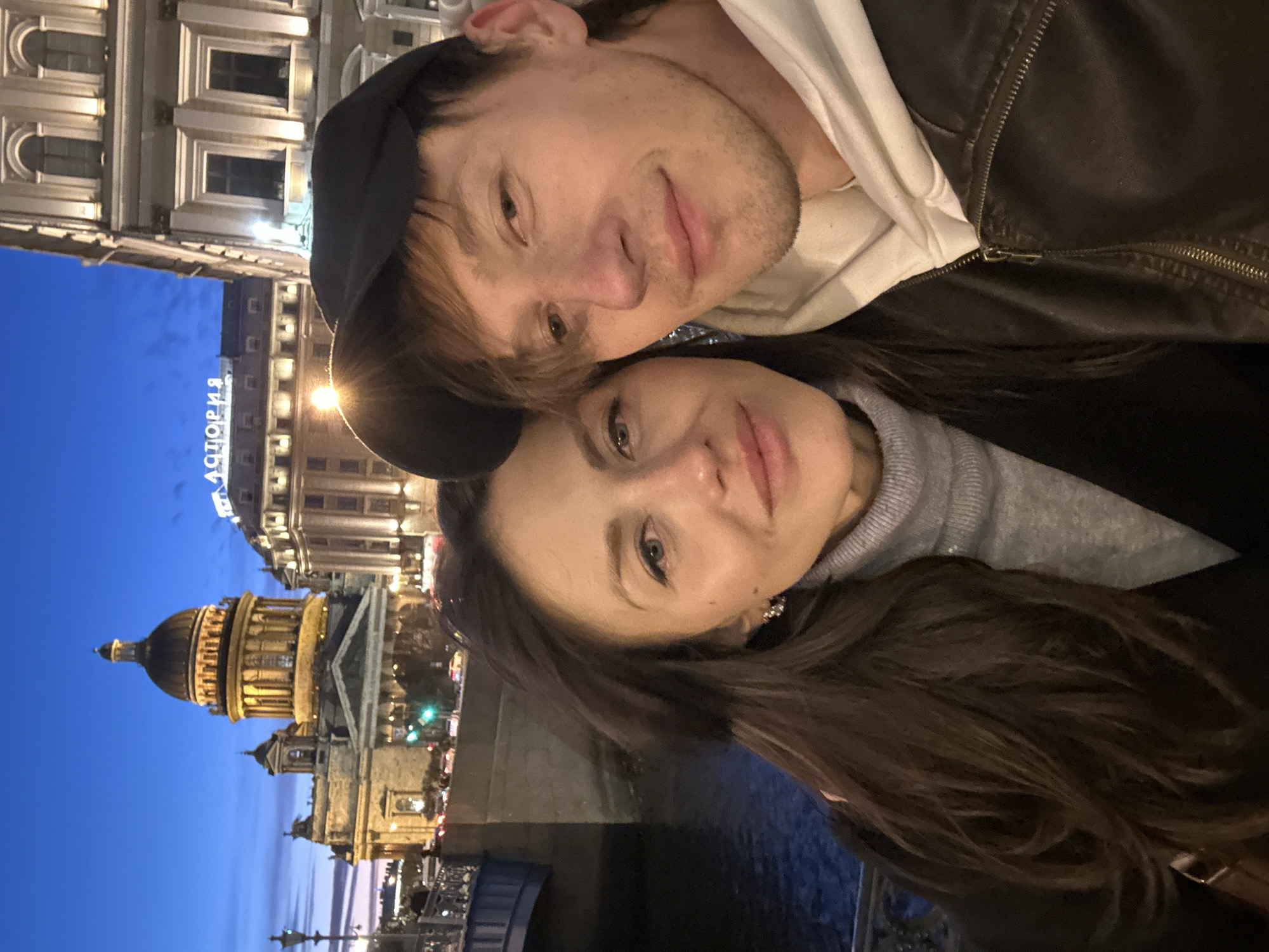 Couple takes selfie near Saint Isaac's Cathedral in Saint Petersburg