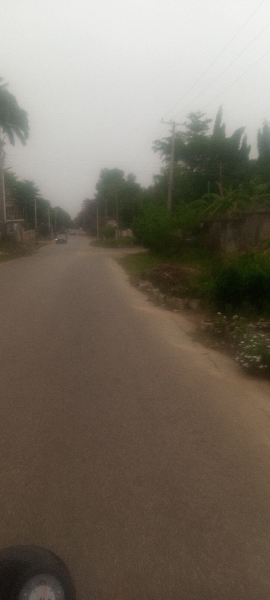 Hazy conditions reduce visibility on Unguwar Rimi street
