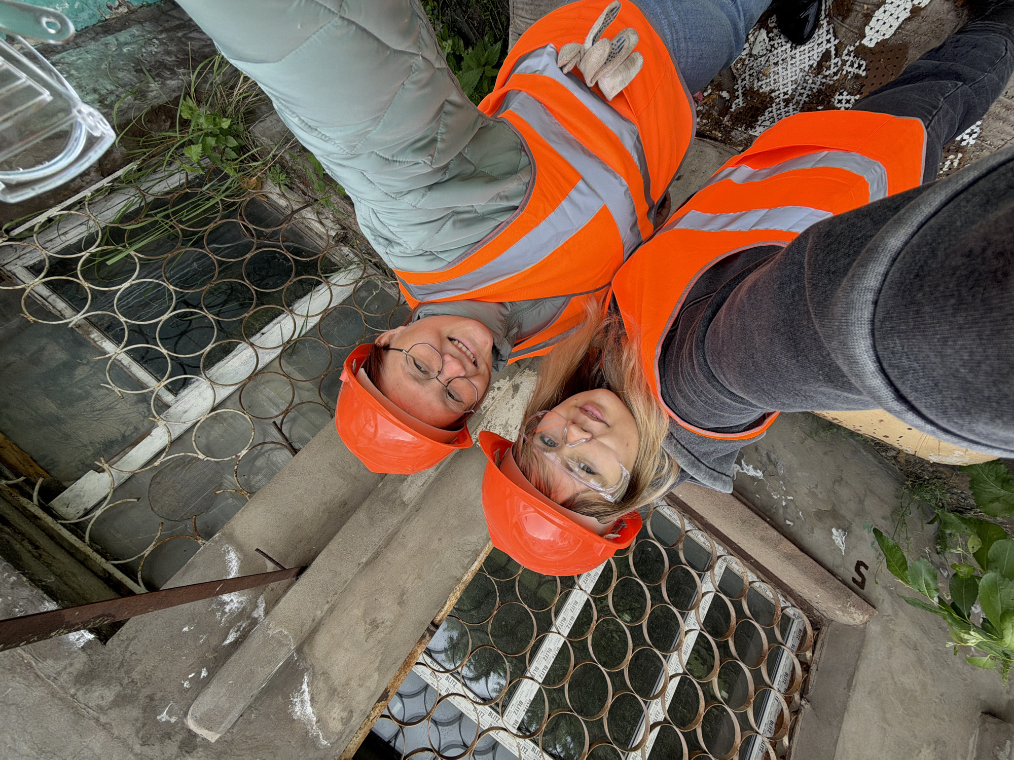 Women Document Safety Work at Demolition Site in Chaikovsky