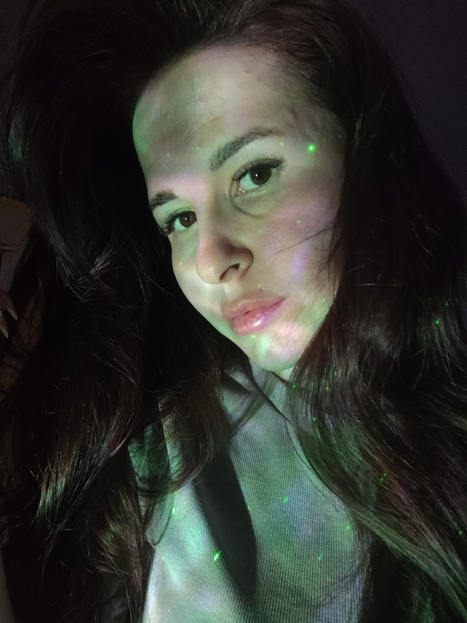 Woman photographed with green light projections in Russian town